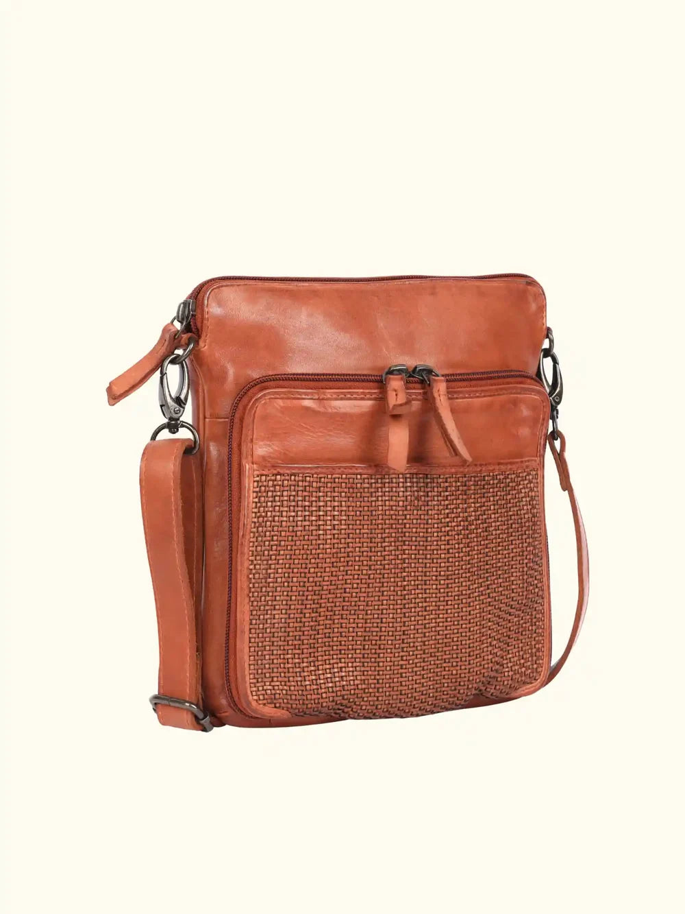 Brown leather crossbody bag with woven pattern on a white background