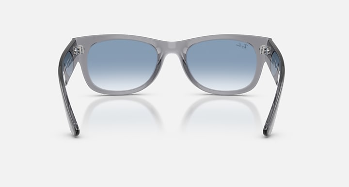 Sunglasses with gray frame and blue gradient lenses on a white background