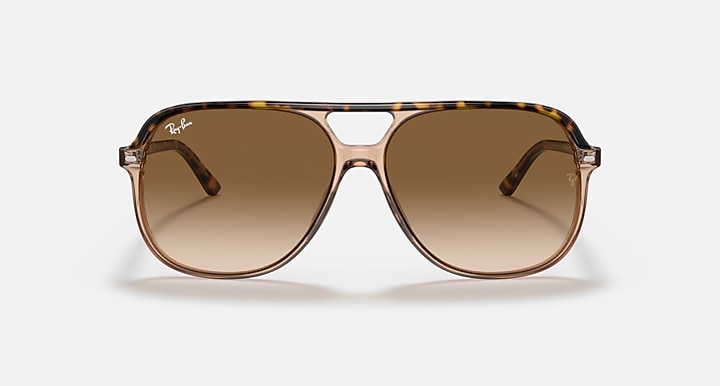 Brown sunglasses with a tortoiseshell frame on a white background