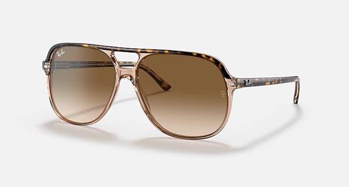 Aviator sunglasses with a tortoiseshell frame and brown gradient lenses on a white background