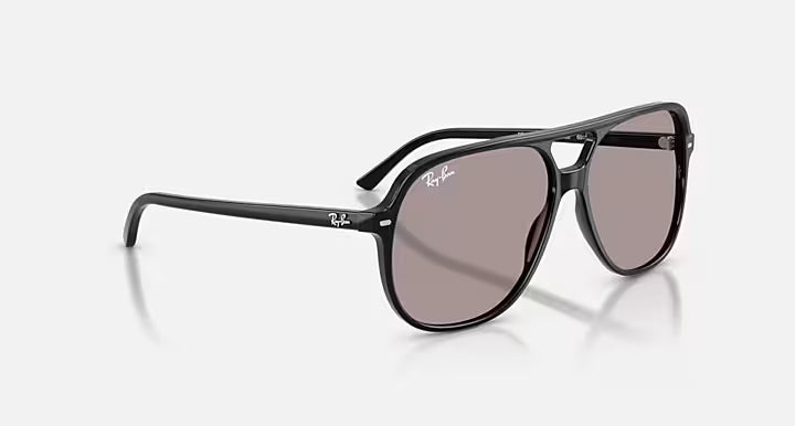 Black sunglasses with a reflective lens on a white background