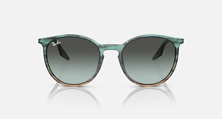 Green sunglasses with gradient lenses on a white background
