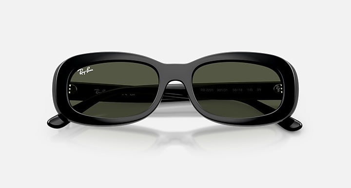 Black sunglasses with a reflective surface on a white background