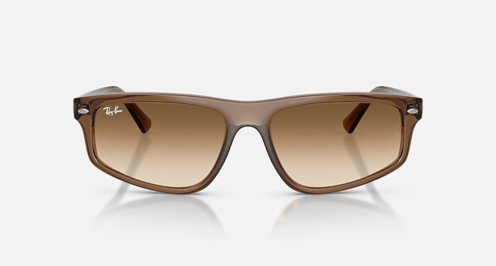 Brown sunglasses with reflective lenses on a white background