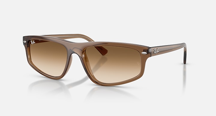 Brown sunglasses with gradient lenses on a white background
