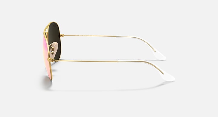 Sunglasses with gold frame and black and pink lenses on a white background