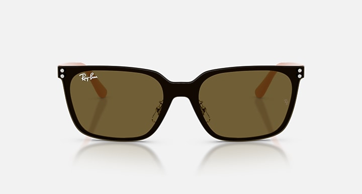 Brown sunglasses with a reflective surface on a white background