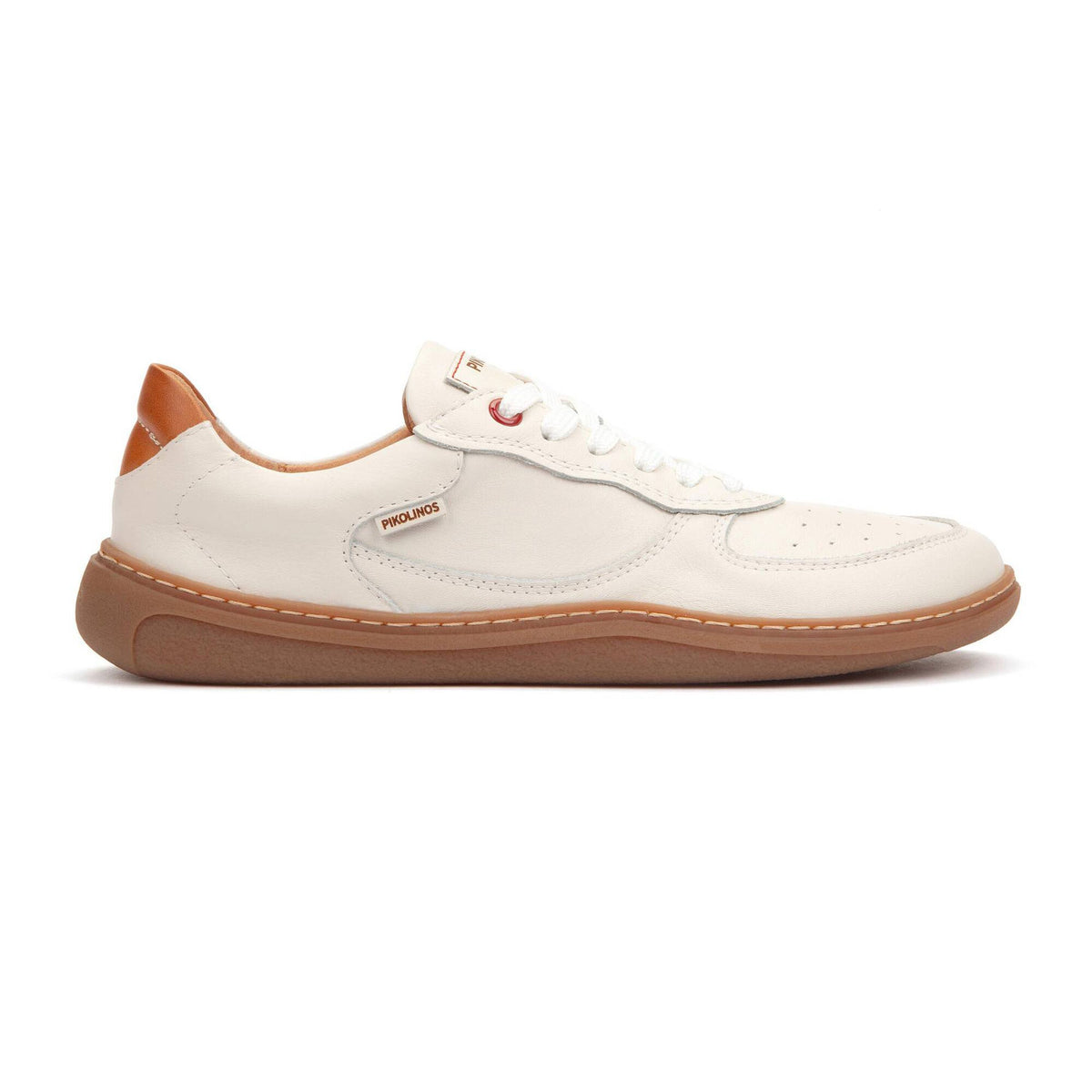 White sneaker with brown sole on a white background