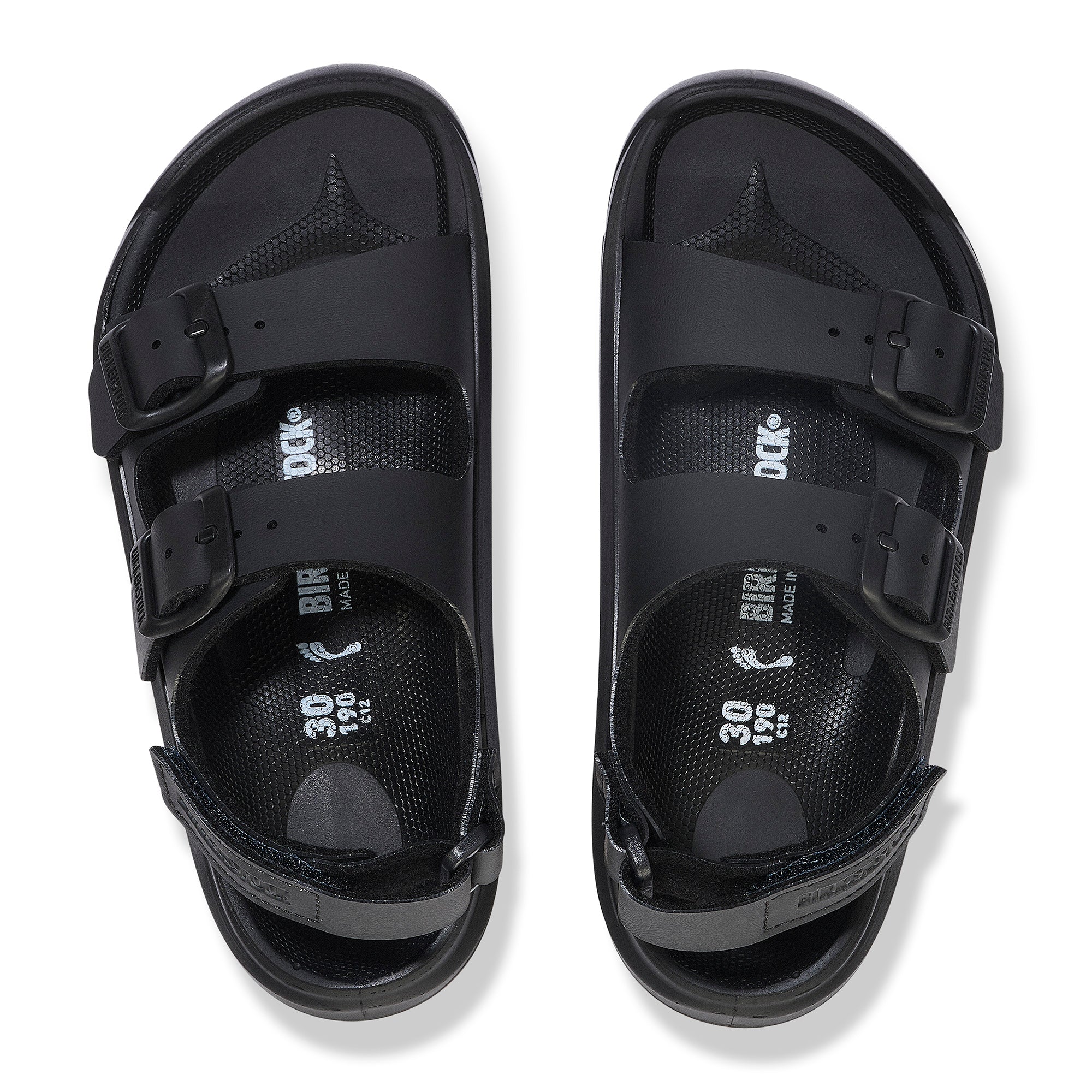 Black sandals with multiple straps on a white background