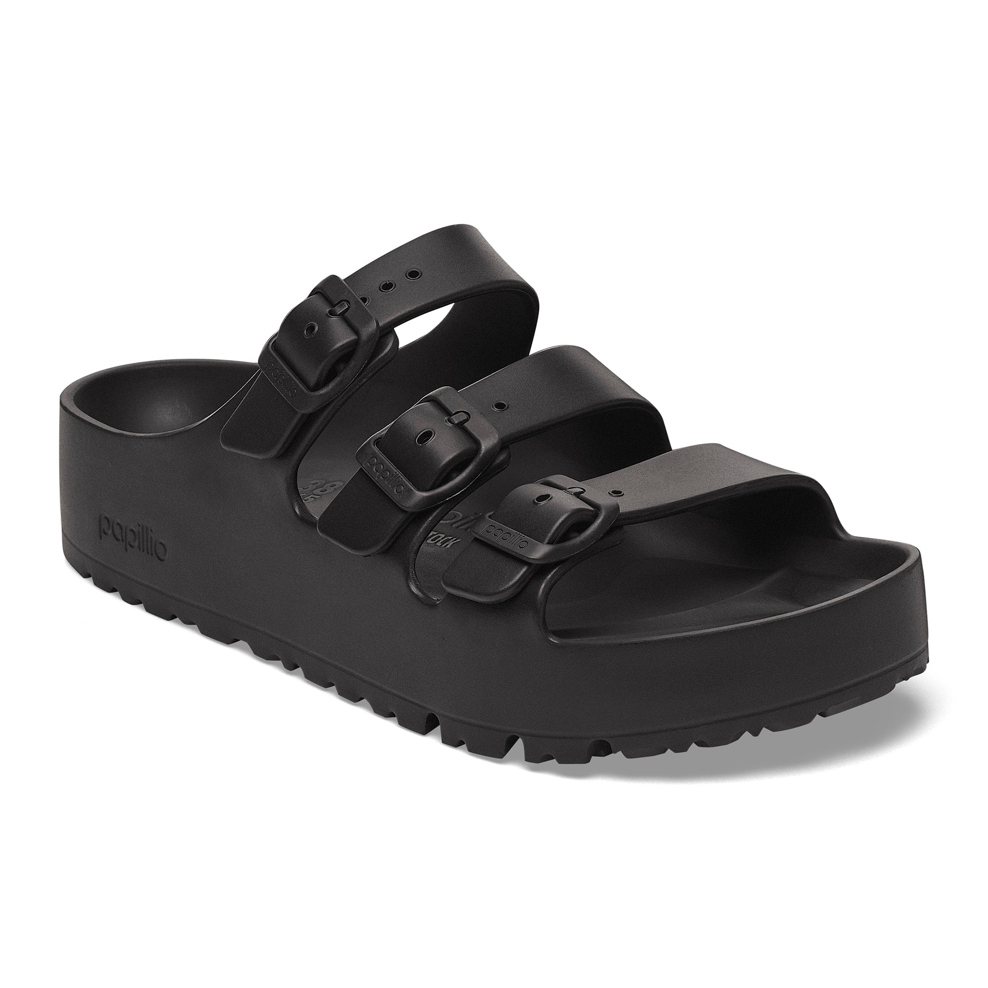 Black sandal with multiple straps on a white background