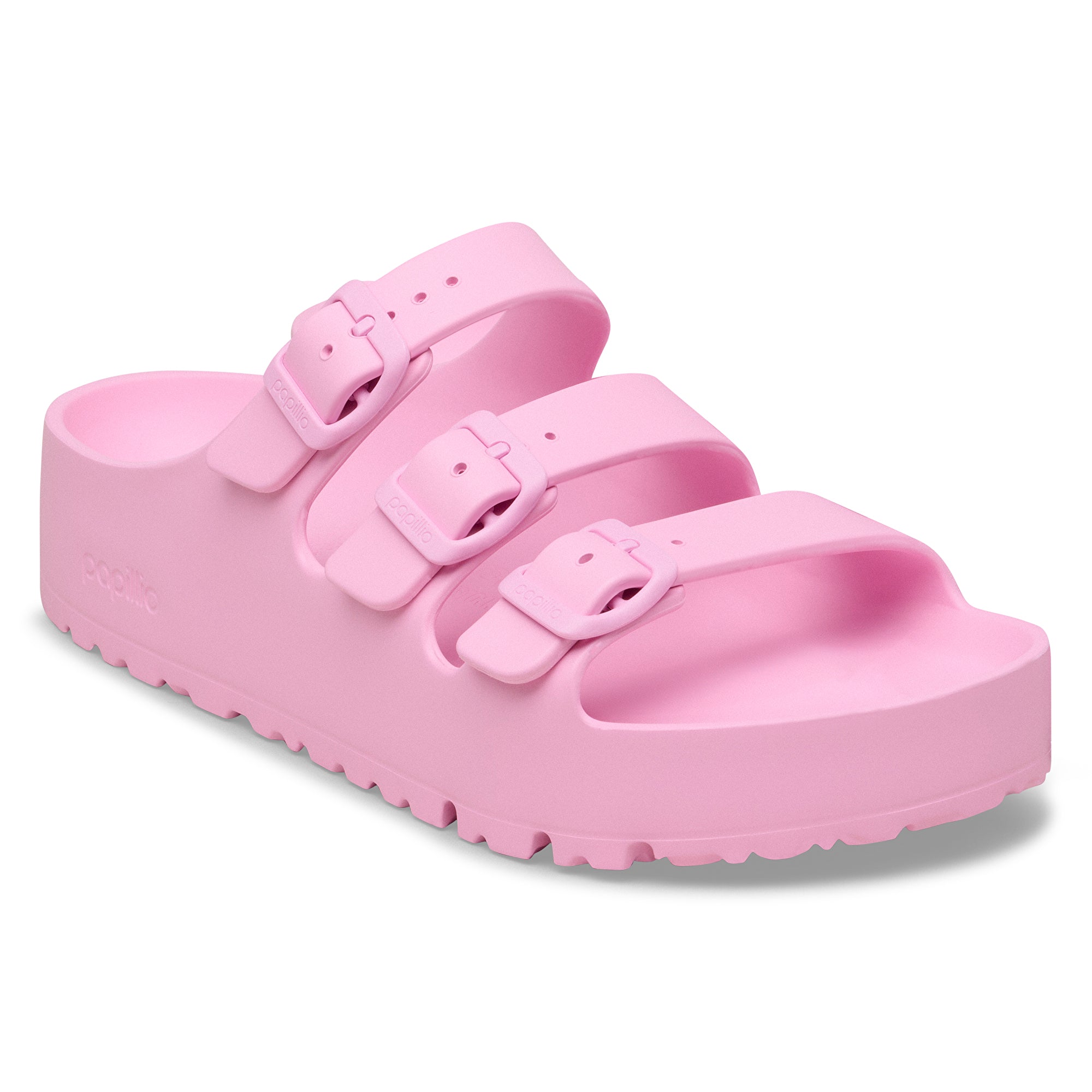 Pink sandal with multiple straps on a white background