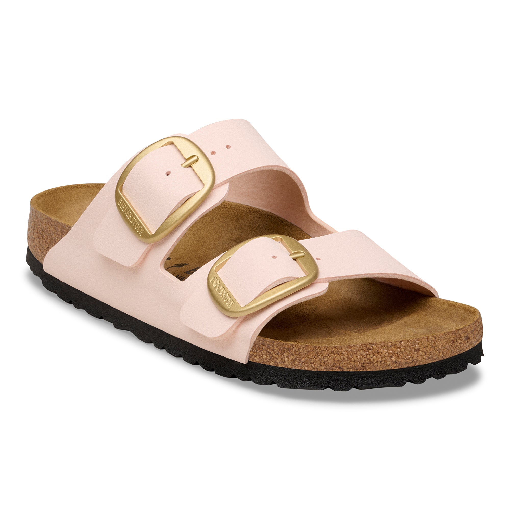 Pink sandal with gold buckles on a white background