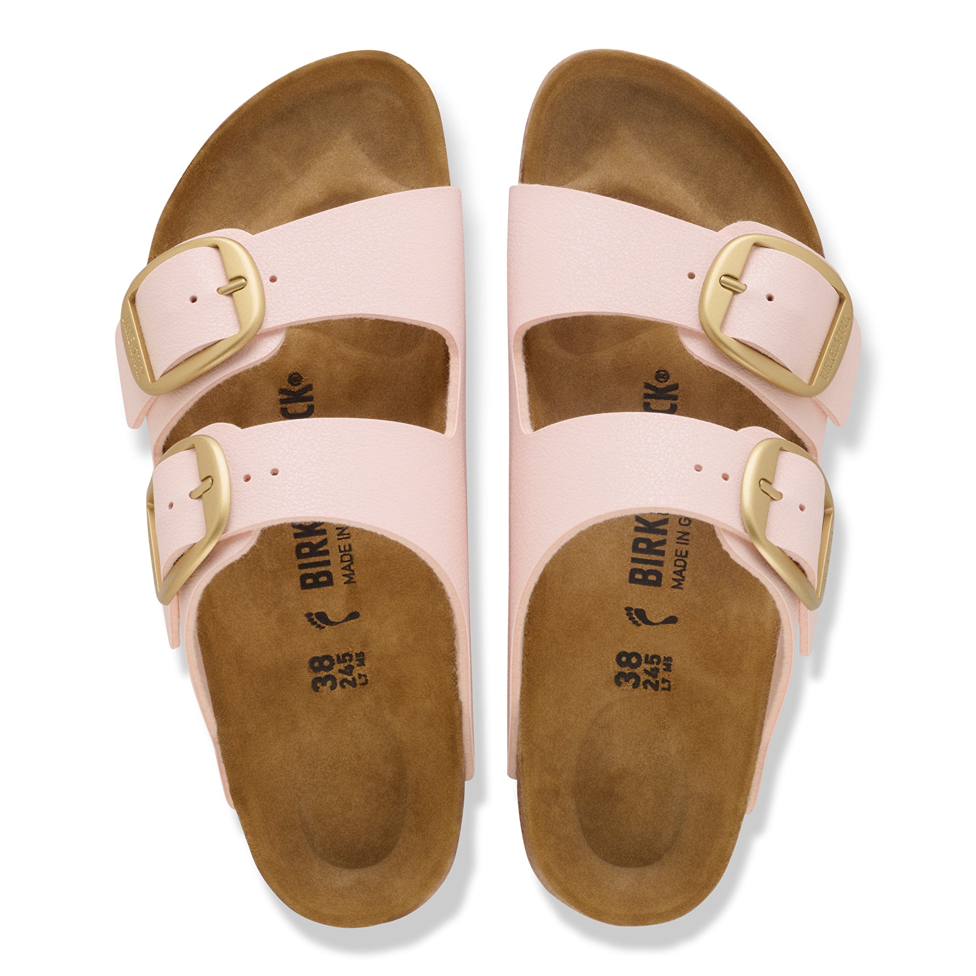 Pair of pink sandals with gold buckles on a white background