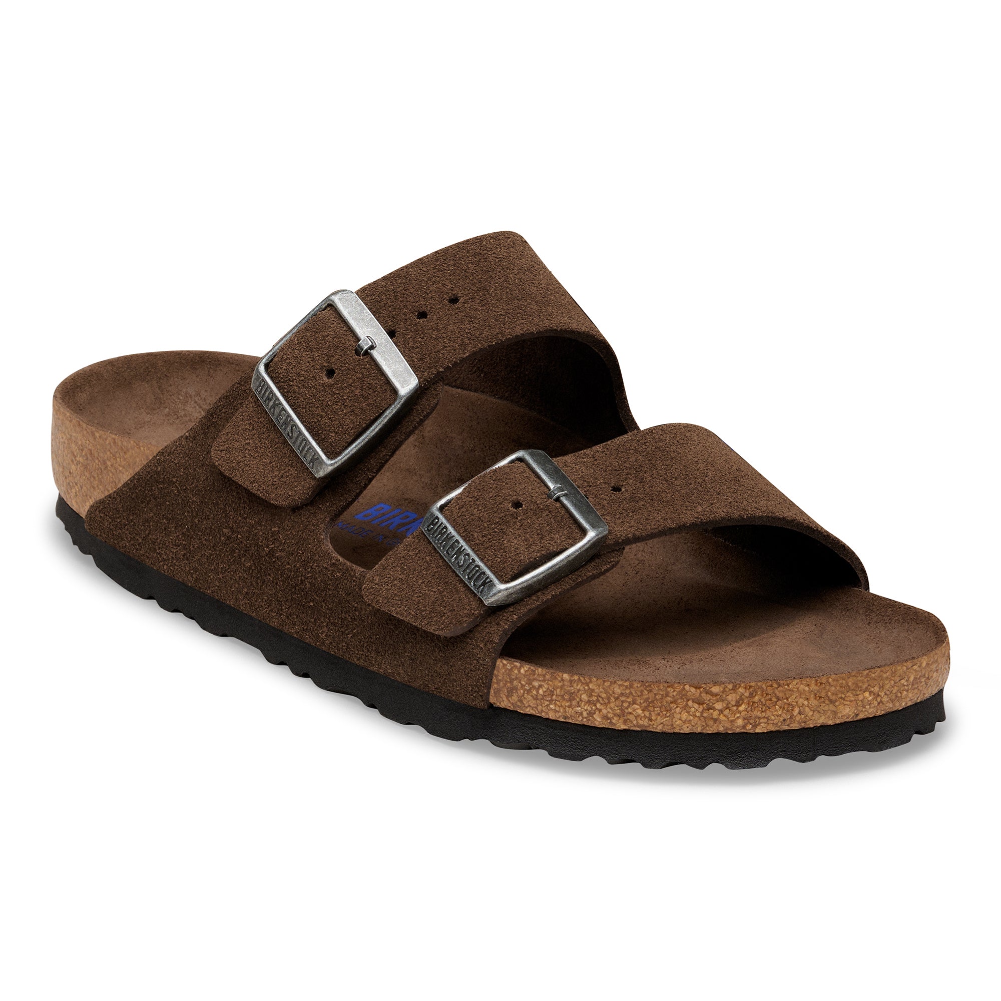 Brown sandal with two buckles on a white background