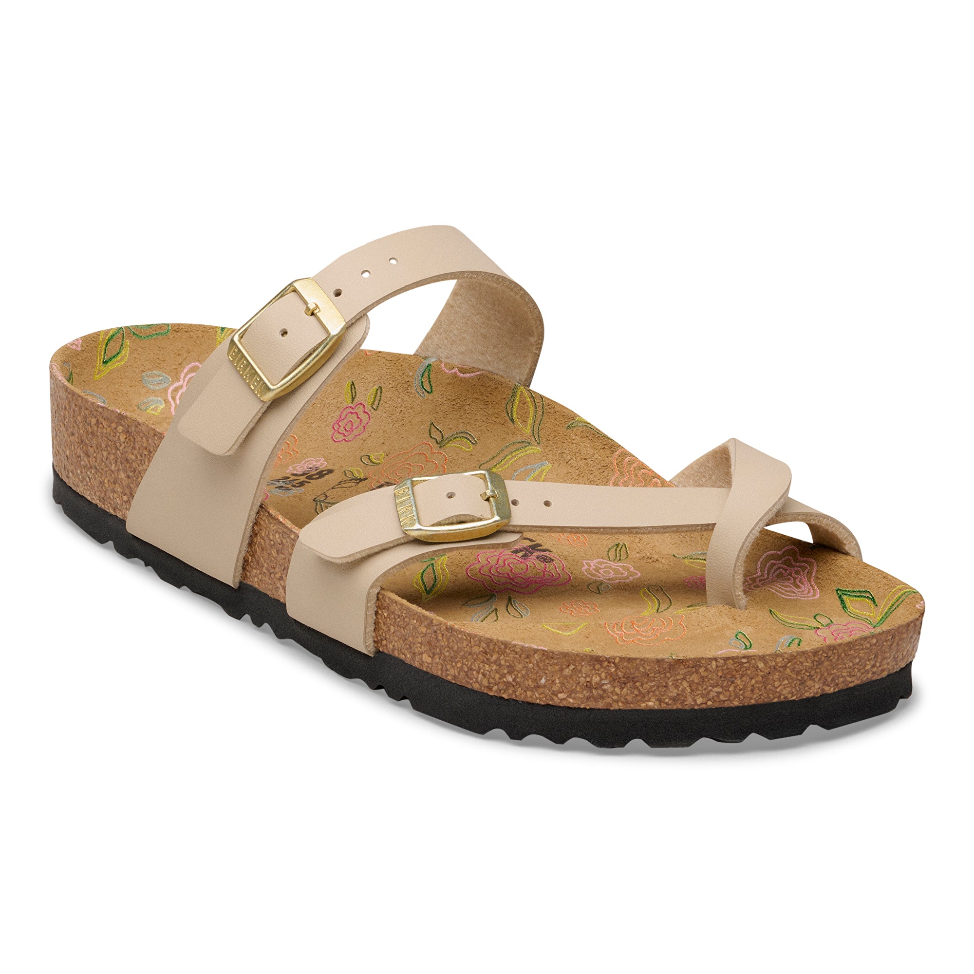 Beige sandal with floral pattern on a white background