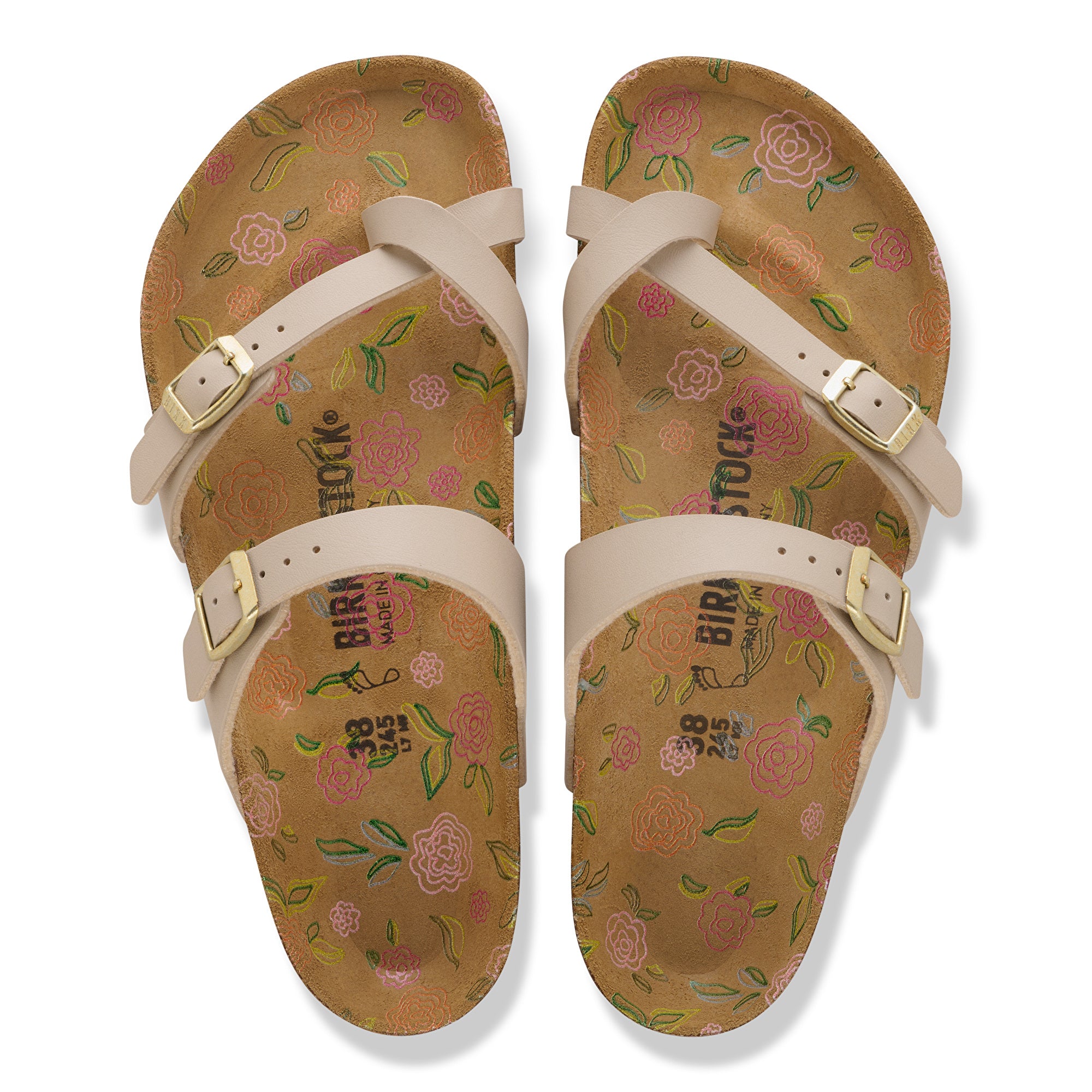 Pair of floral-patterned sandals with beige straps on a white background