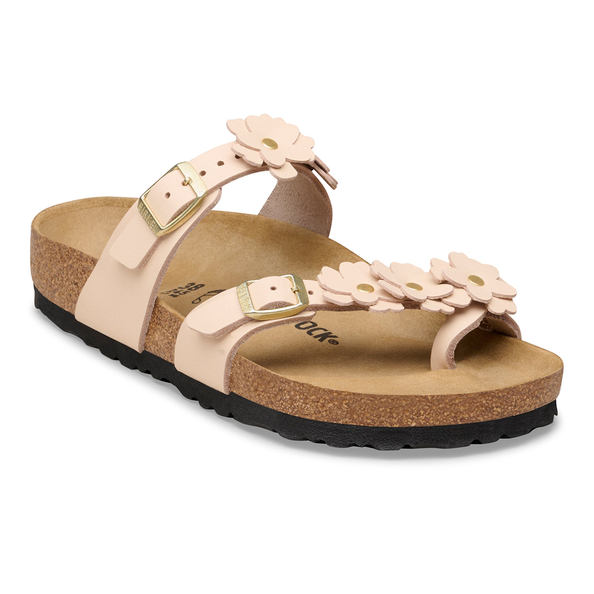 Beige sandal with floral design and black sole on a white background
