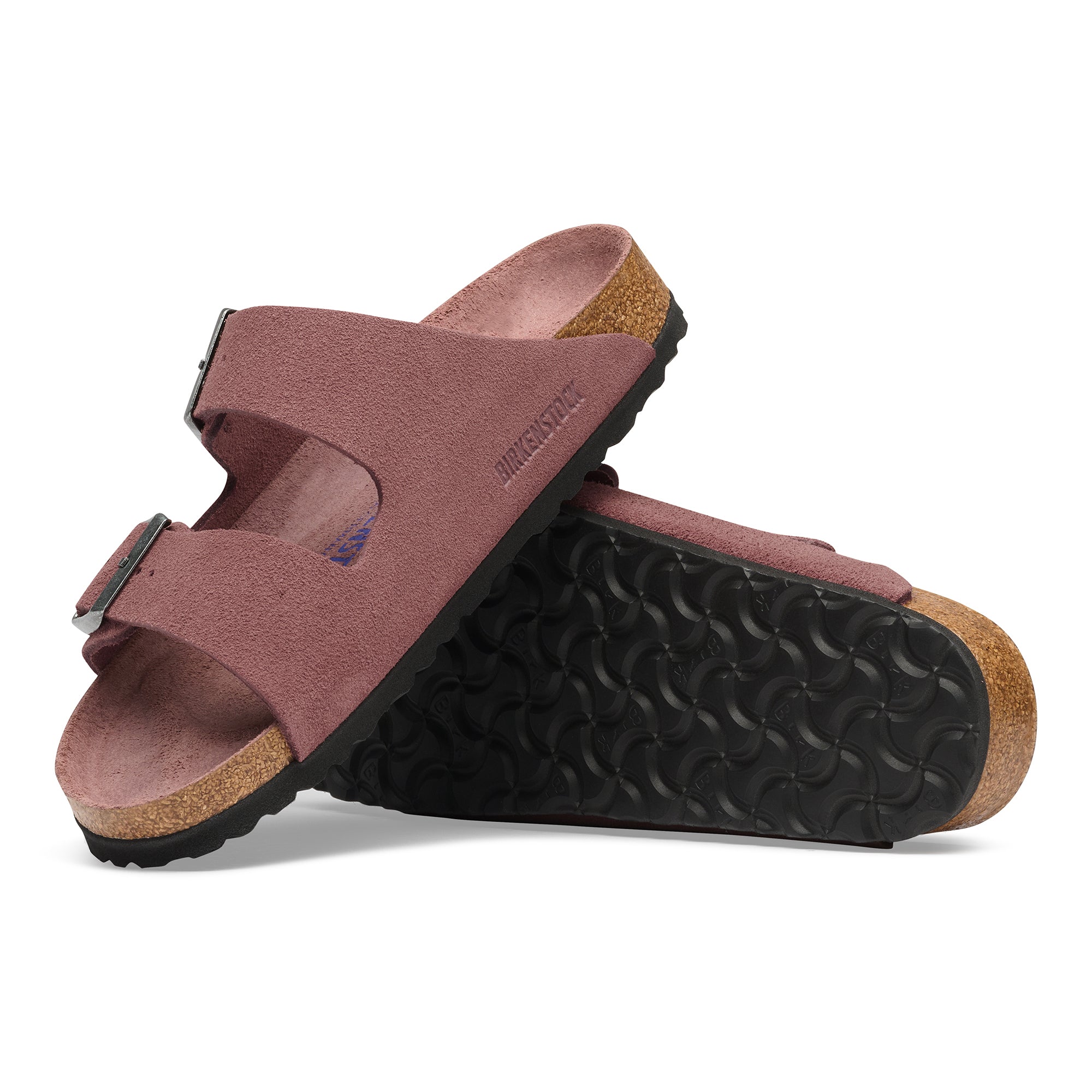 Pair of maroon sandals with cork sole on a white background