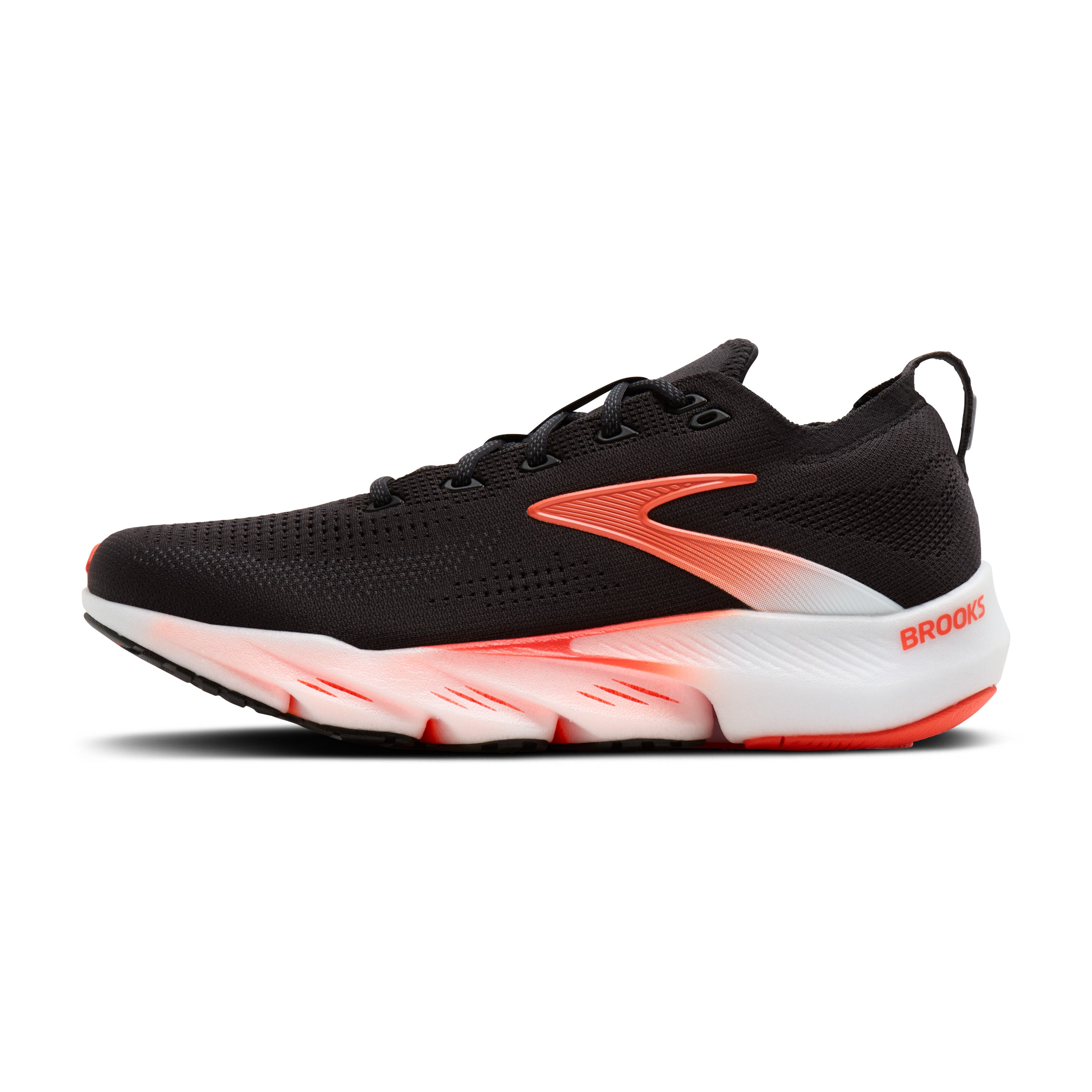 Black running shoe with orange and white sole on a white background