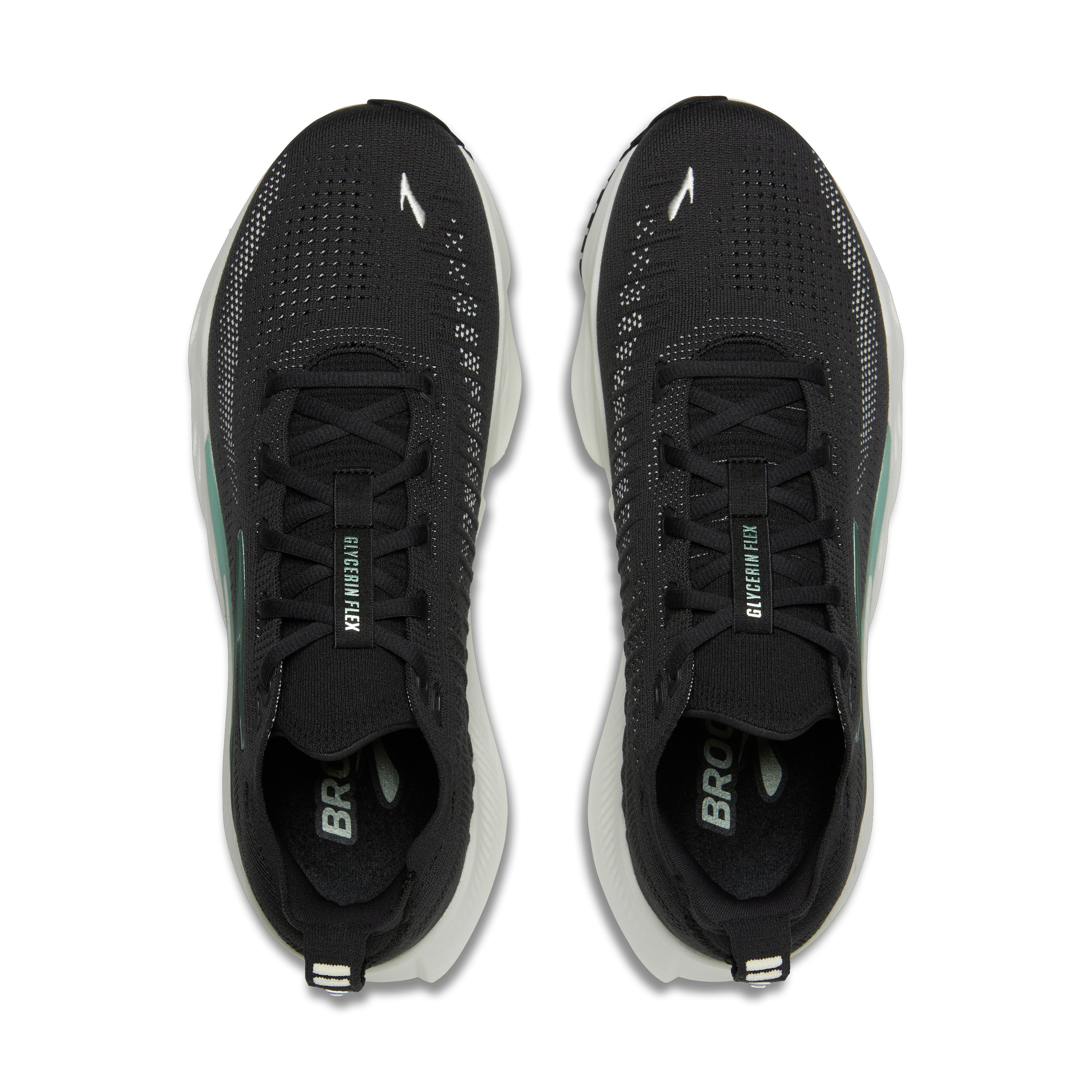 Black athletic shoes with white soles on a white background