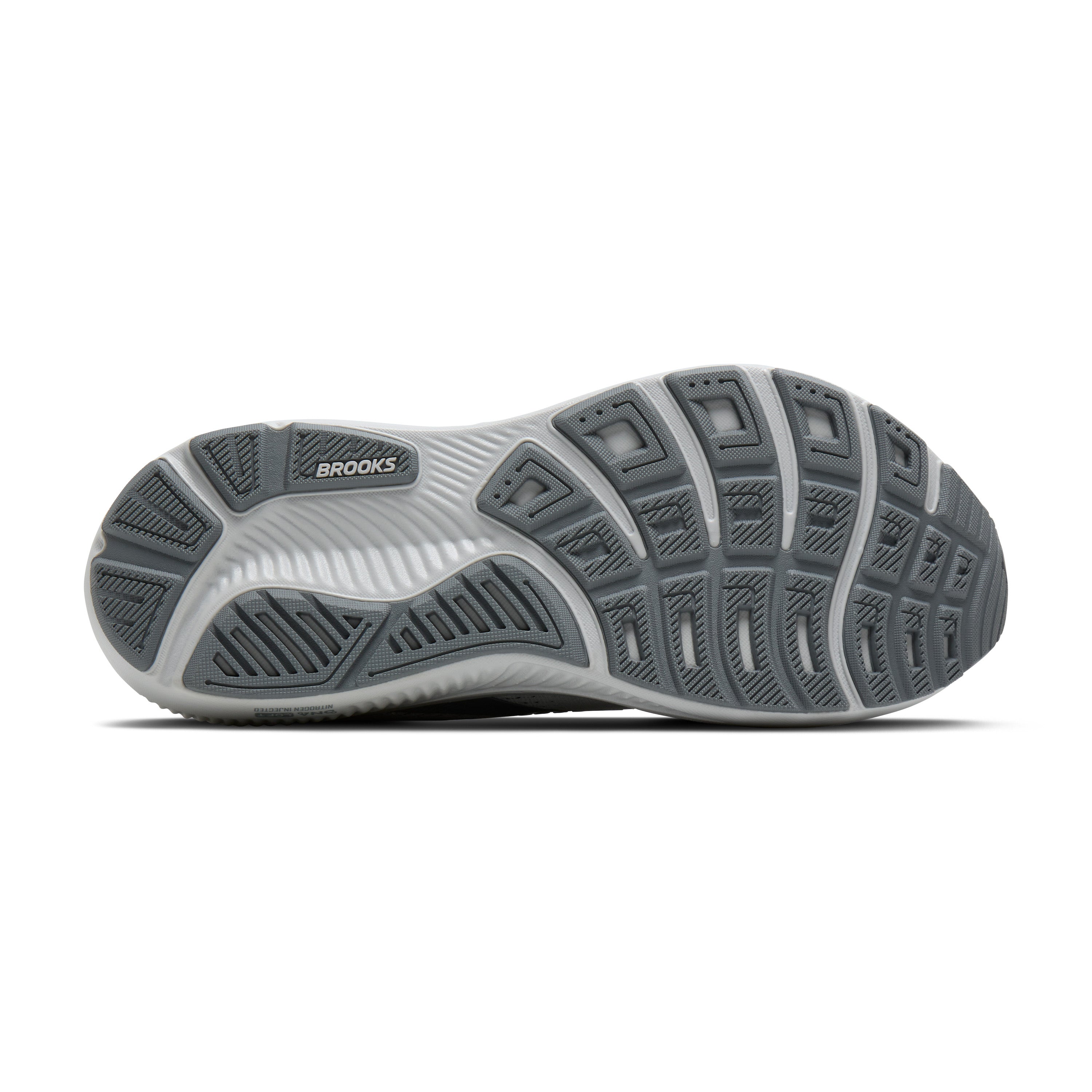 Sole of a shoe with brown and white sole design on a white background