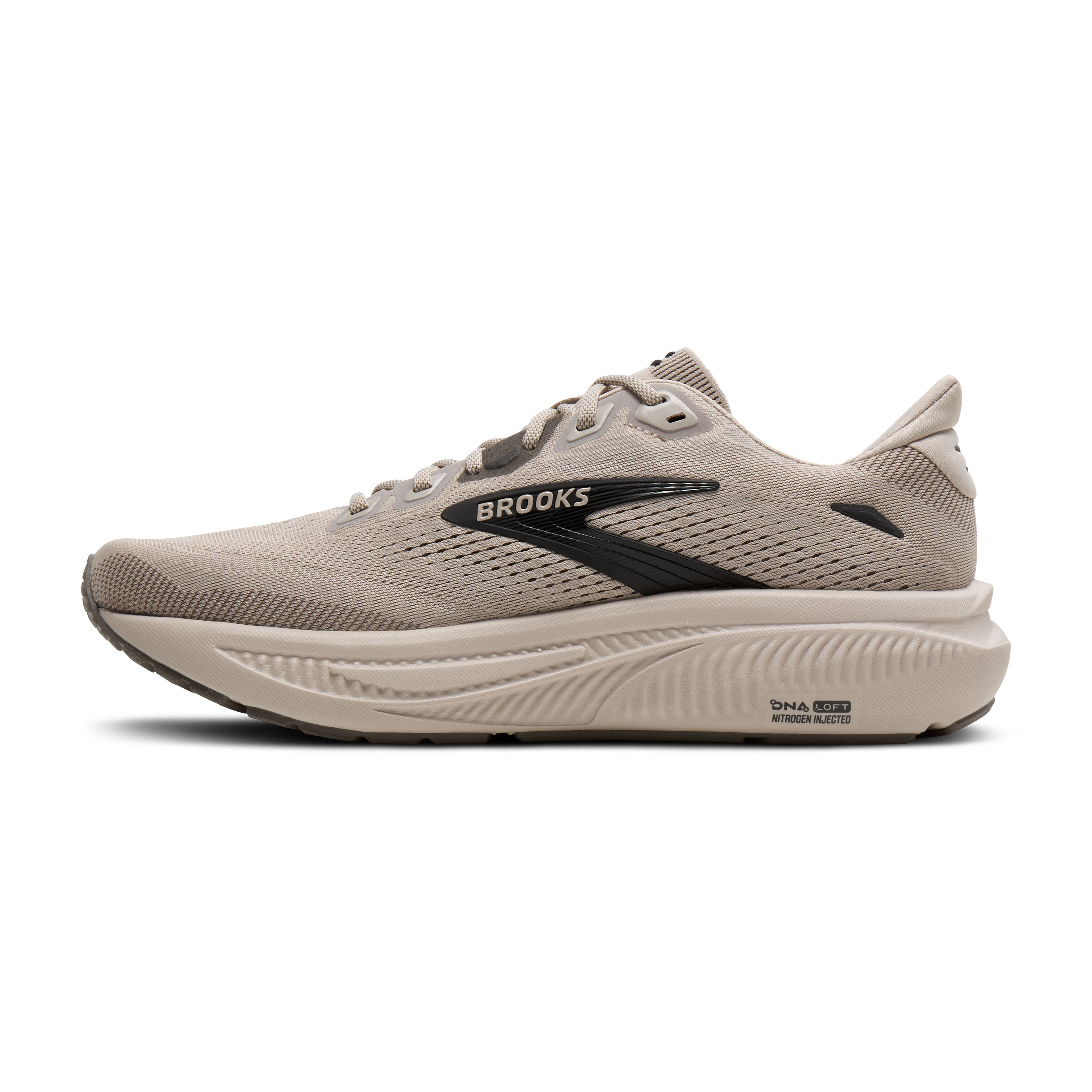 A single Brooks running shoe in a light taupe-beige colorway with a black logo stripe and black outsole details, shown in a side profile on a white background.