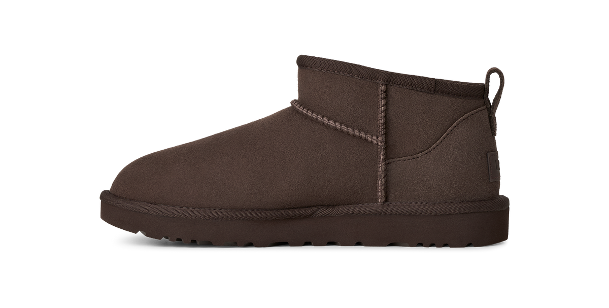 A single dark brown suede ankle boot with contrast stitching and a pull tab, shown in a side profile on a white background.