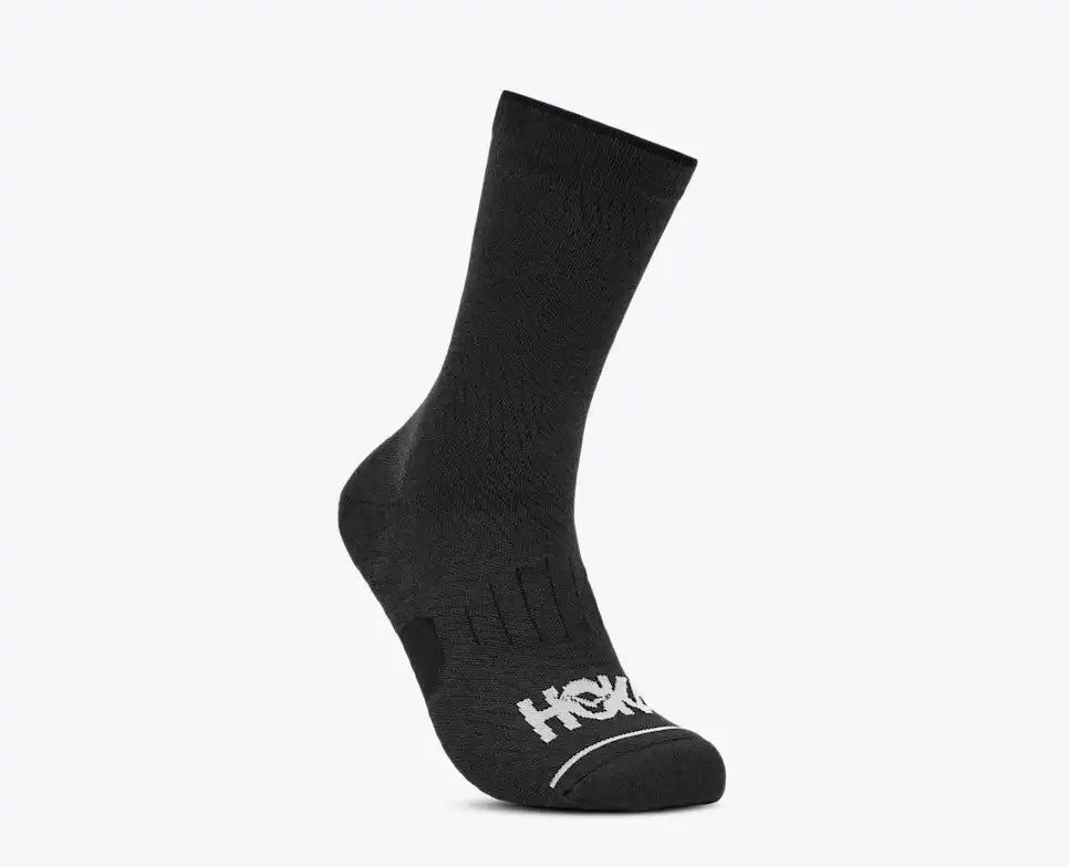 Black sock with 'Hoka' branding on a white background