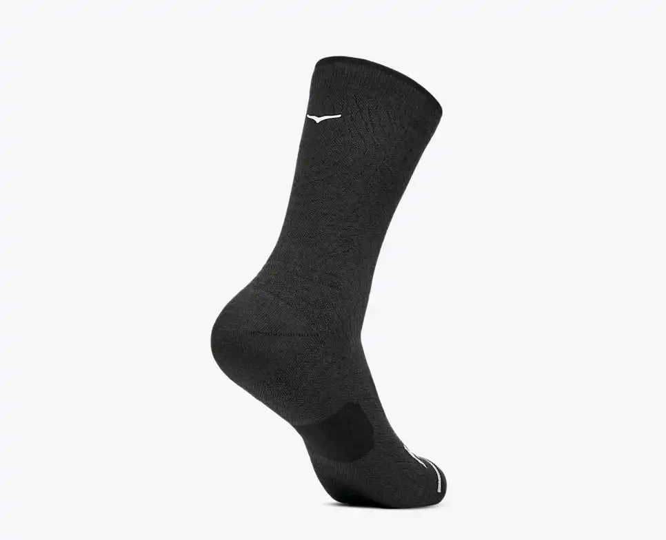 A single black athletic crew sock shown on a foot form against a plain white background.