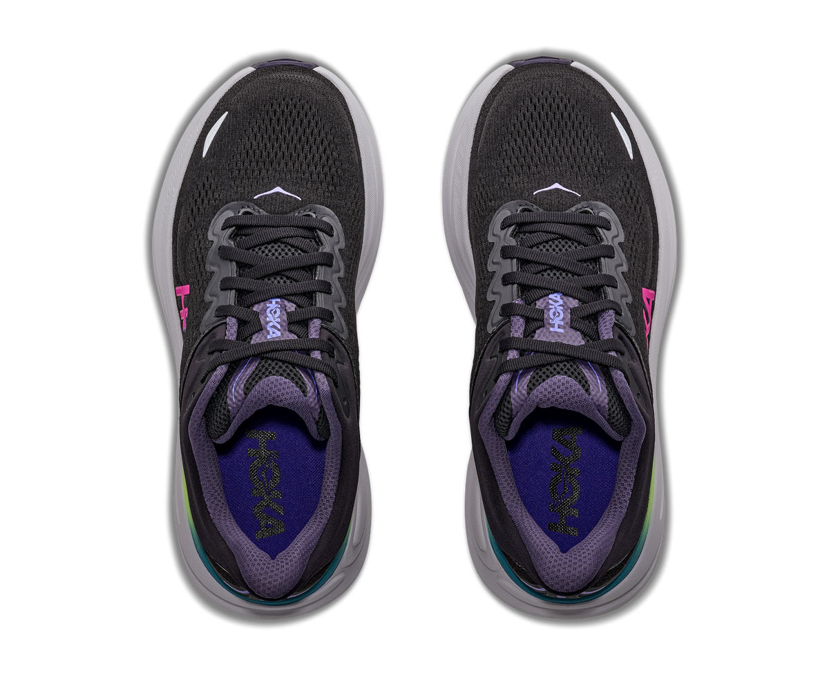 Pair of black and purple running shoes on a white background