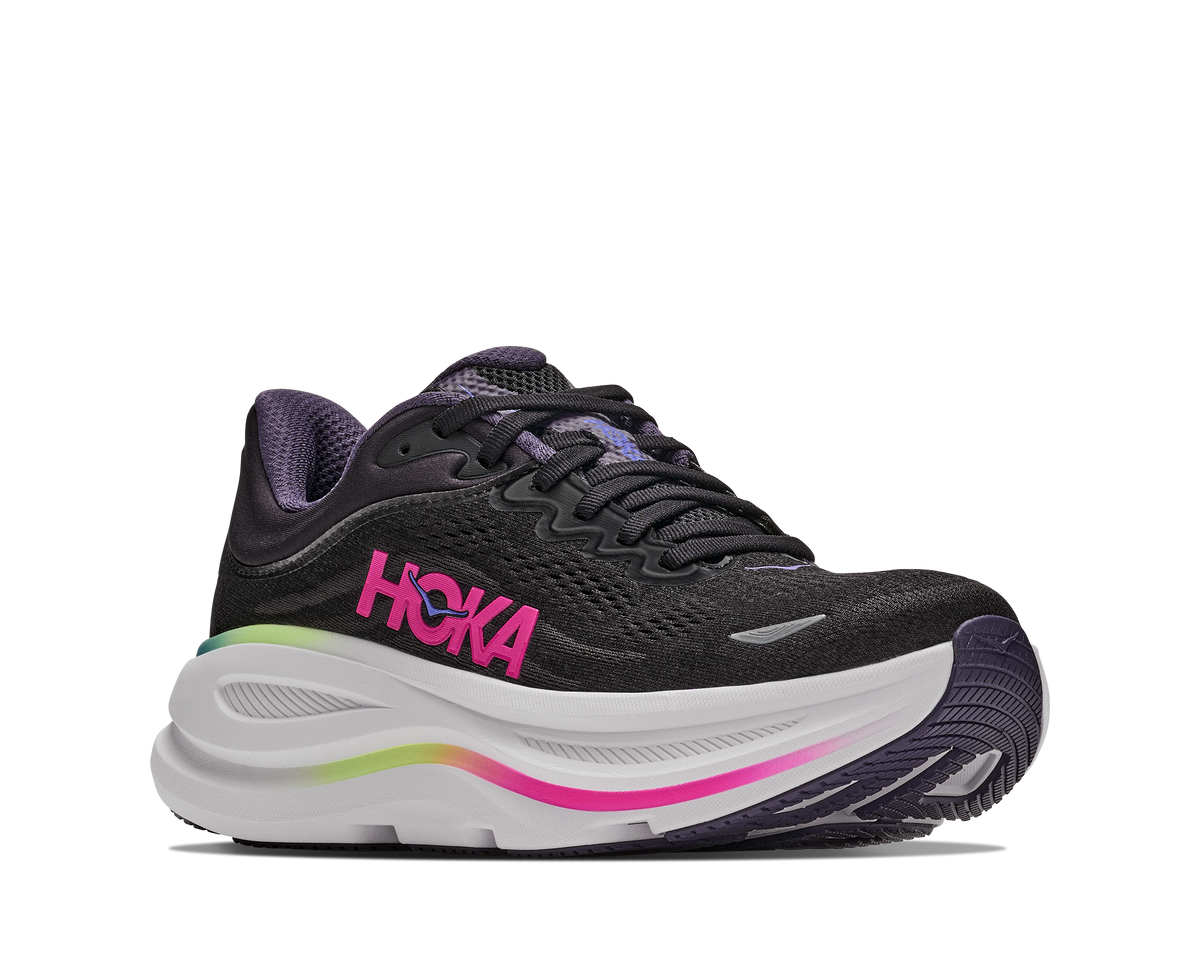 Black running shoe with pink Hoka logo on a white background