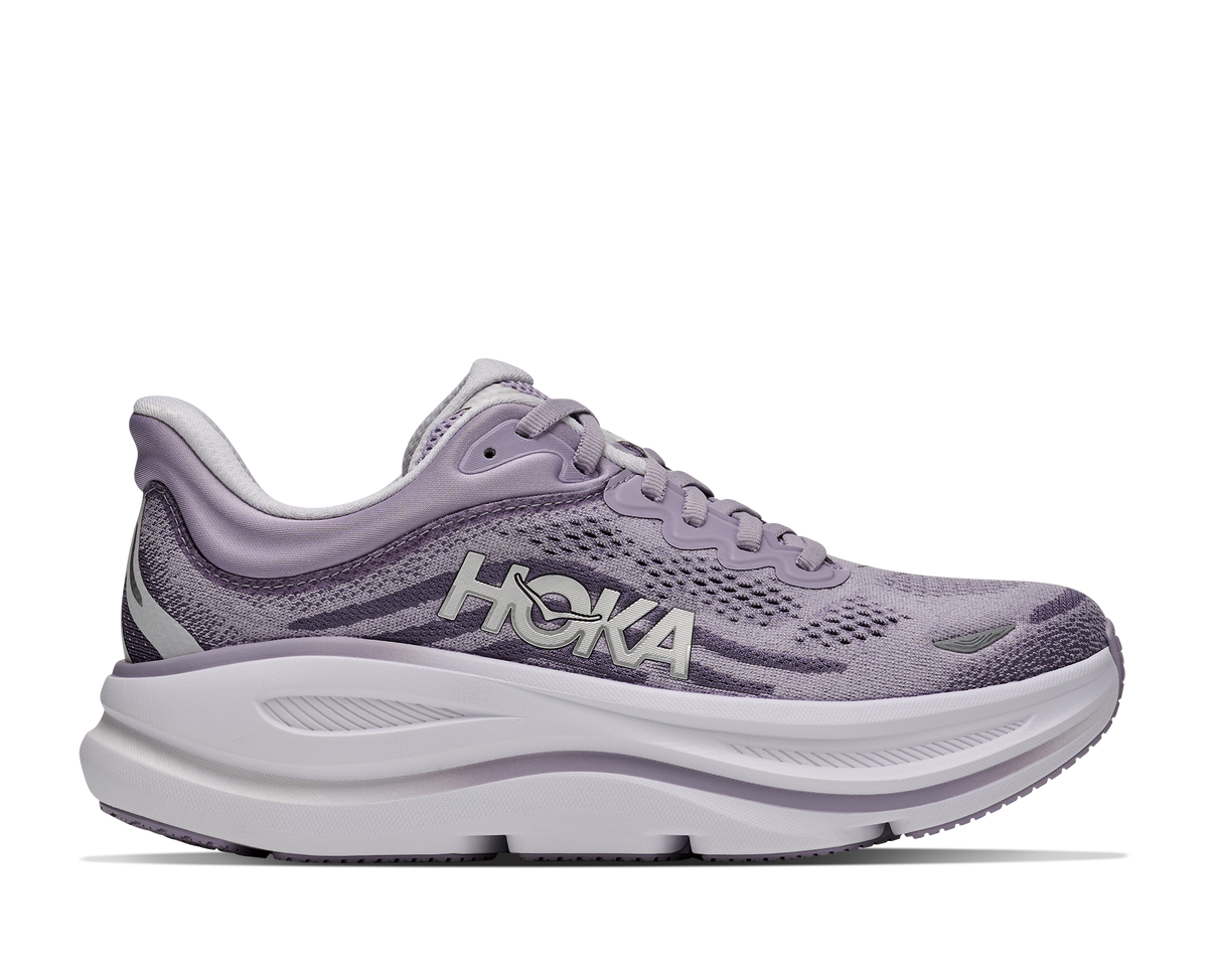 Purple running shoe with white sole on a white background