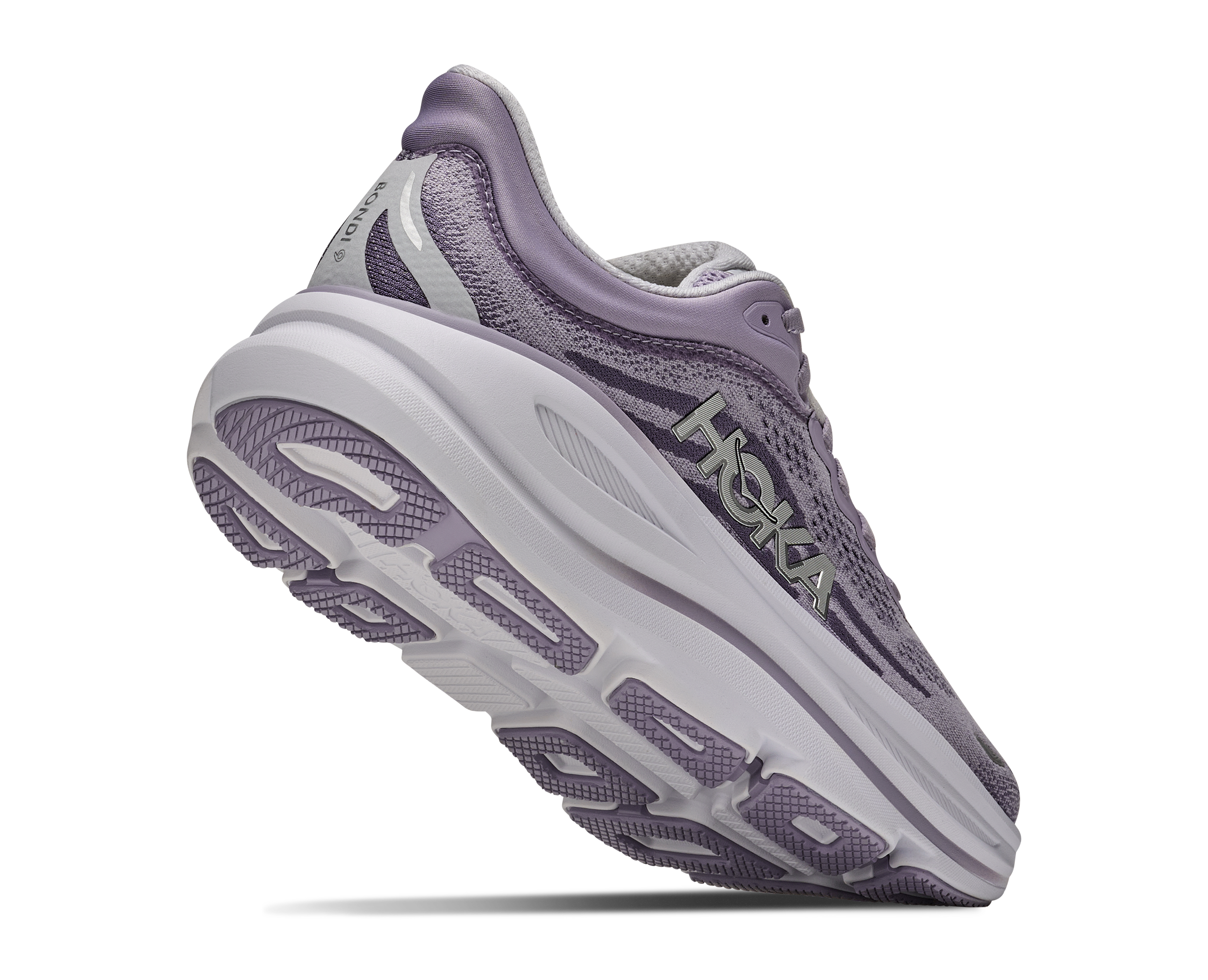 Purple running shoe with white sole on a white background