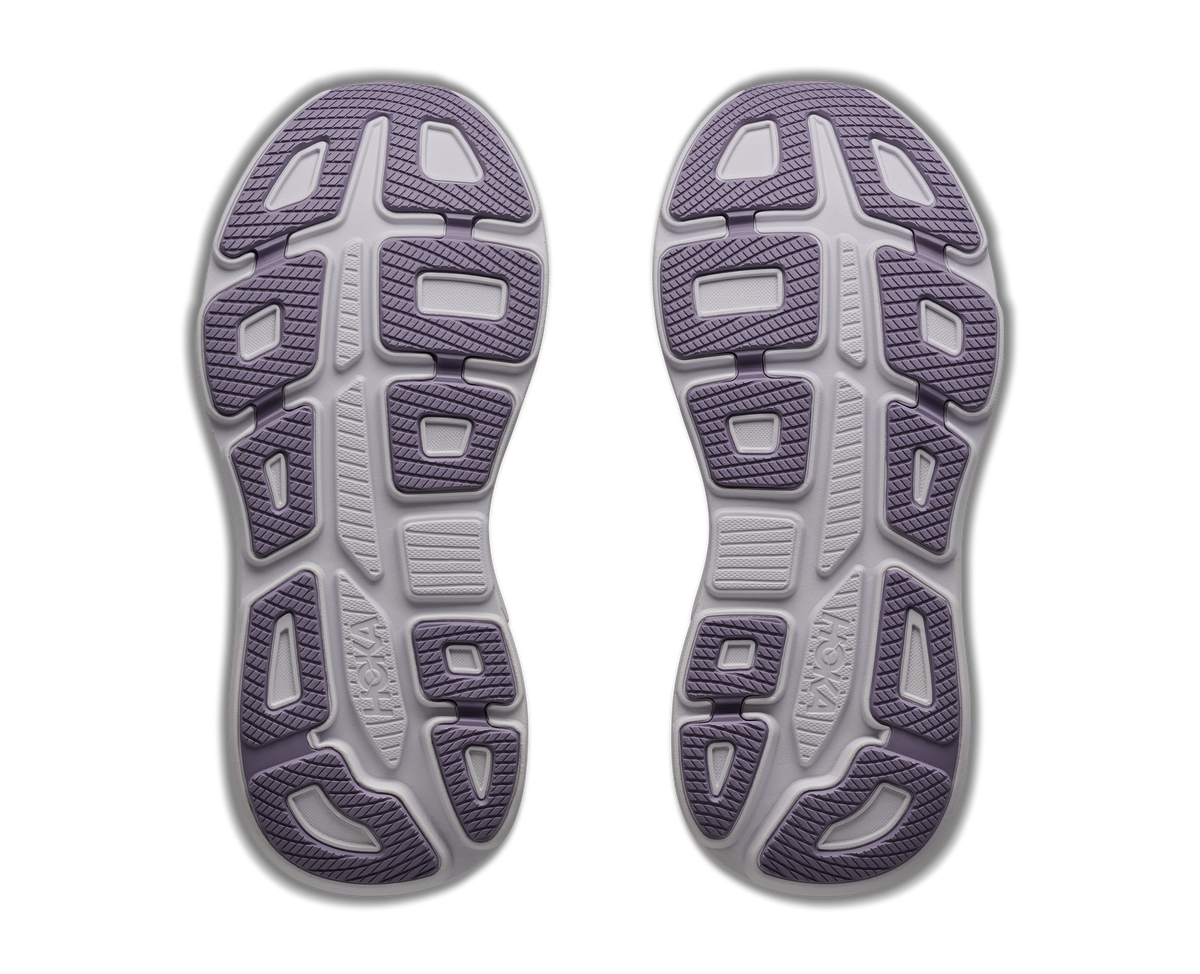 Top view of a pair of gray athletic shoes with purple accents on a white background