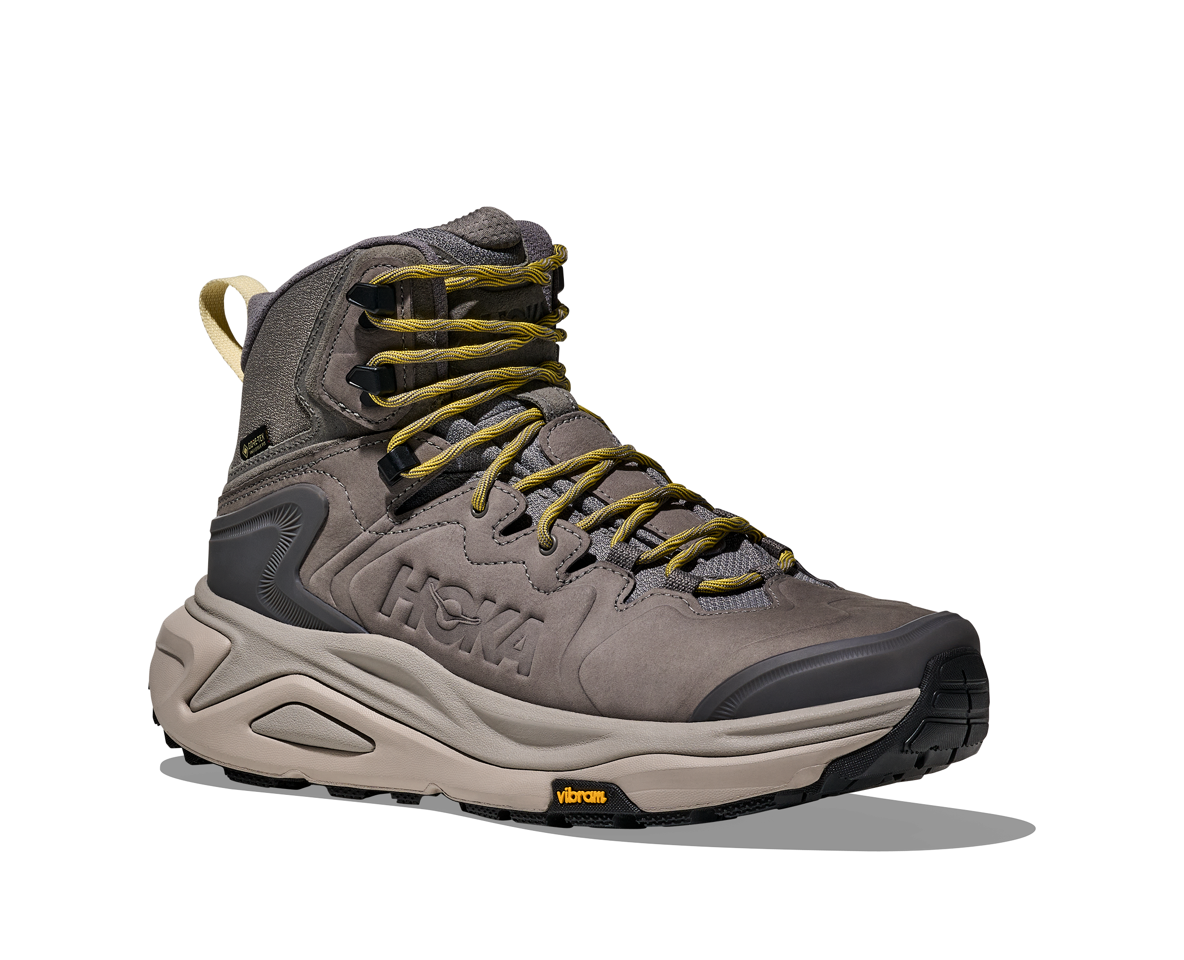 A HOKA mid-top hiking boot in gray and beige with olive green laces, shown from a side profile on a white background with a soft shadow.