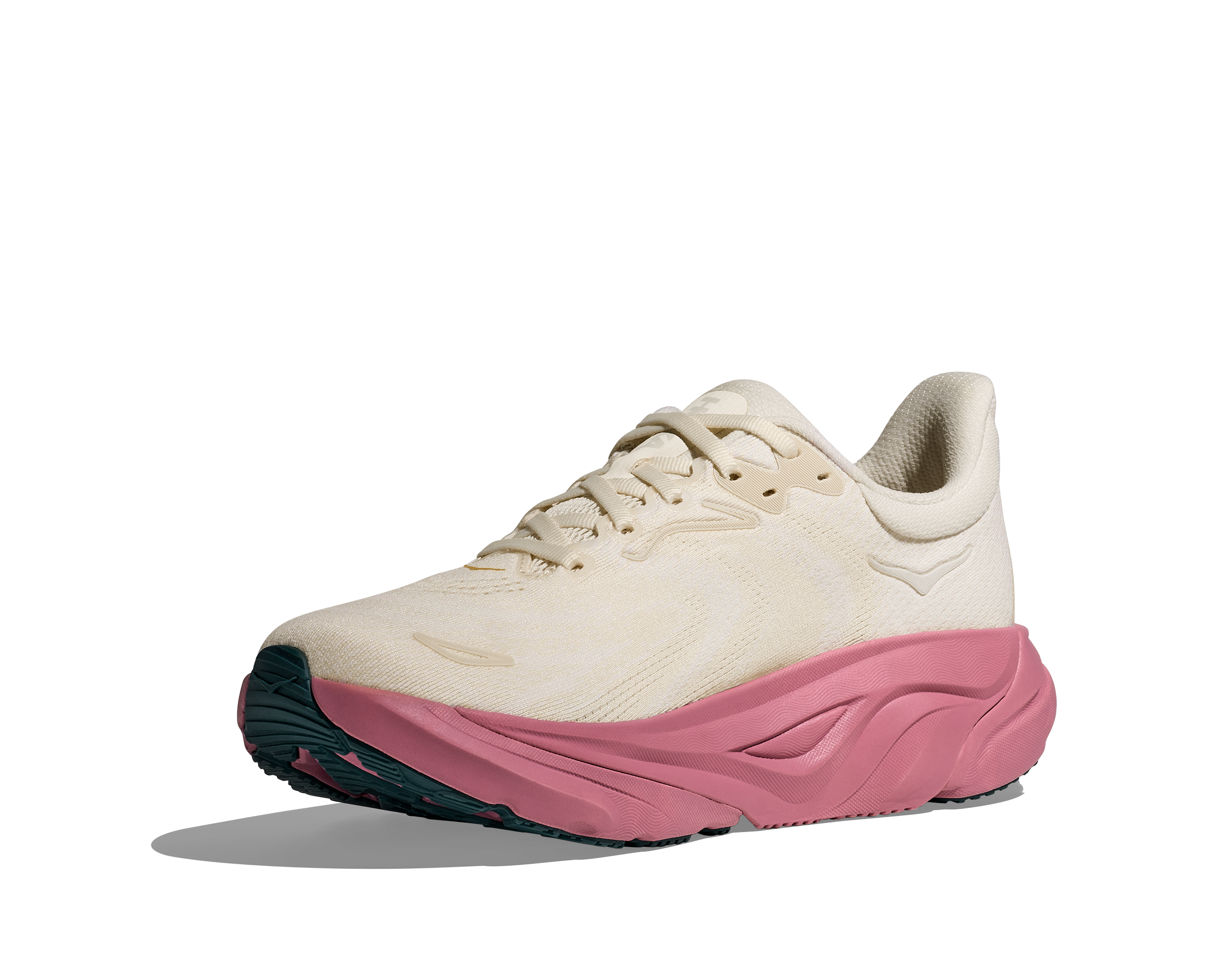 White running shoe with pink sole on a transparent background