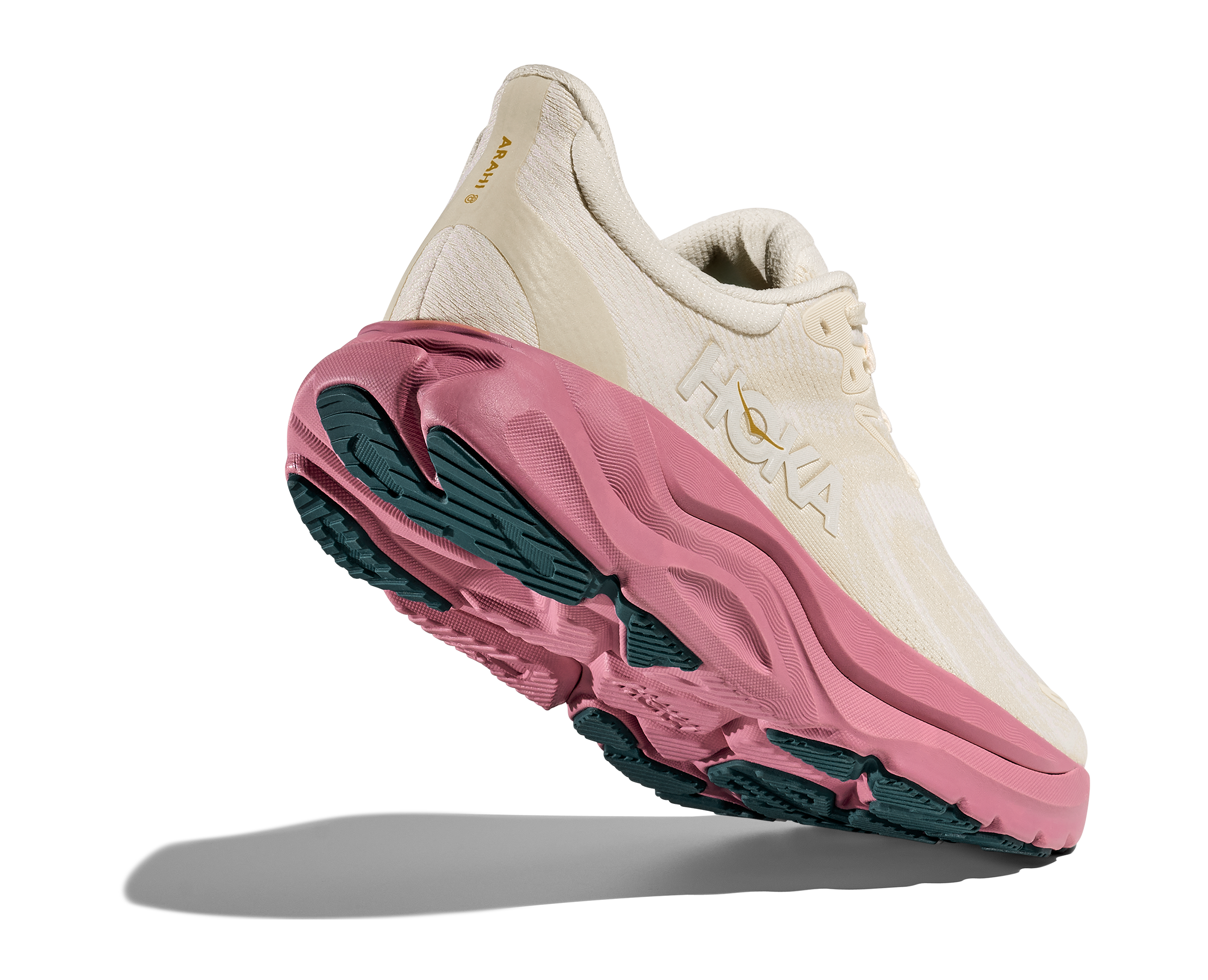 Sneaker with a white upper and pink sole on a transparent background