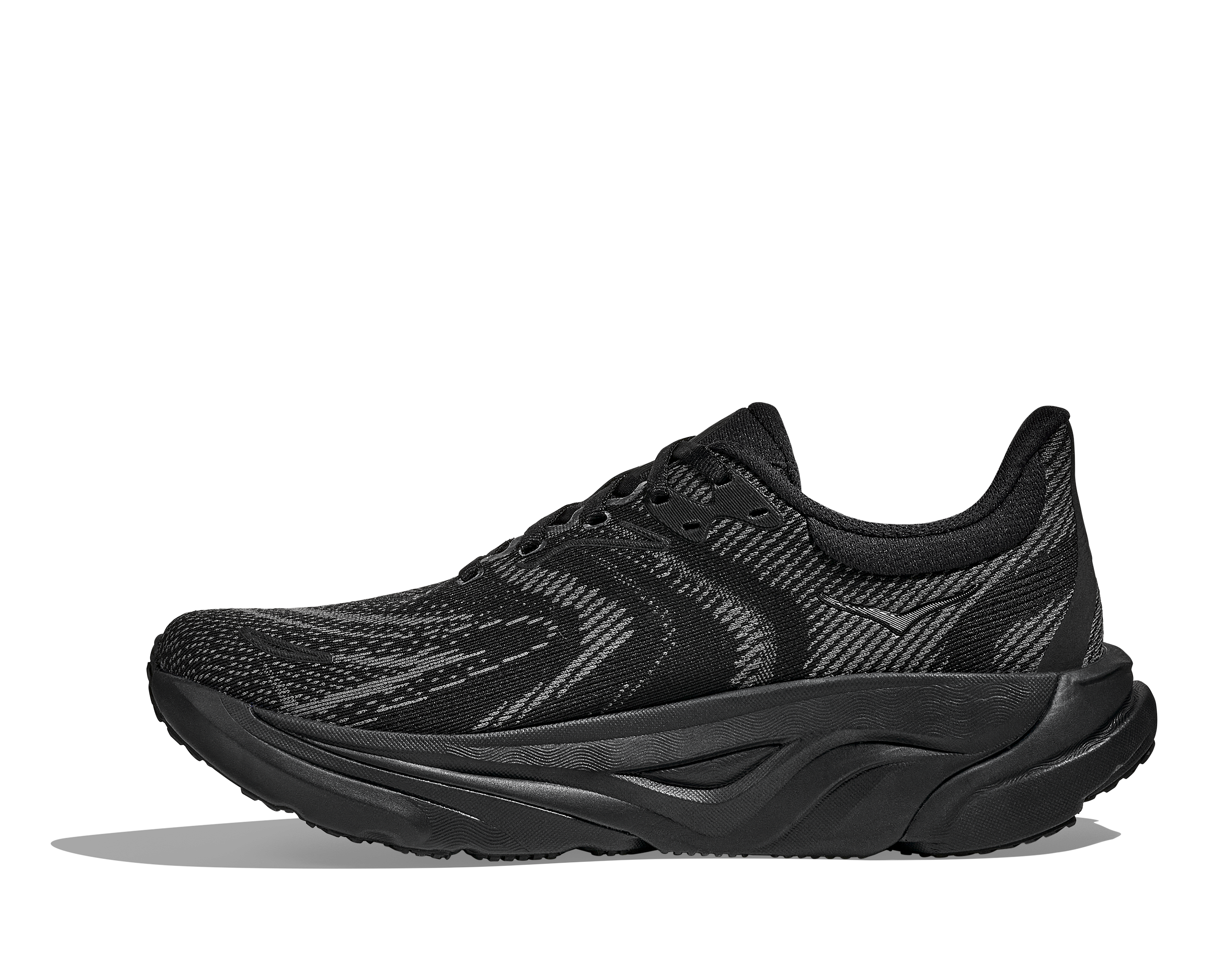 Black running shoe with hoka logo on a white background