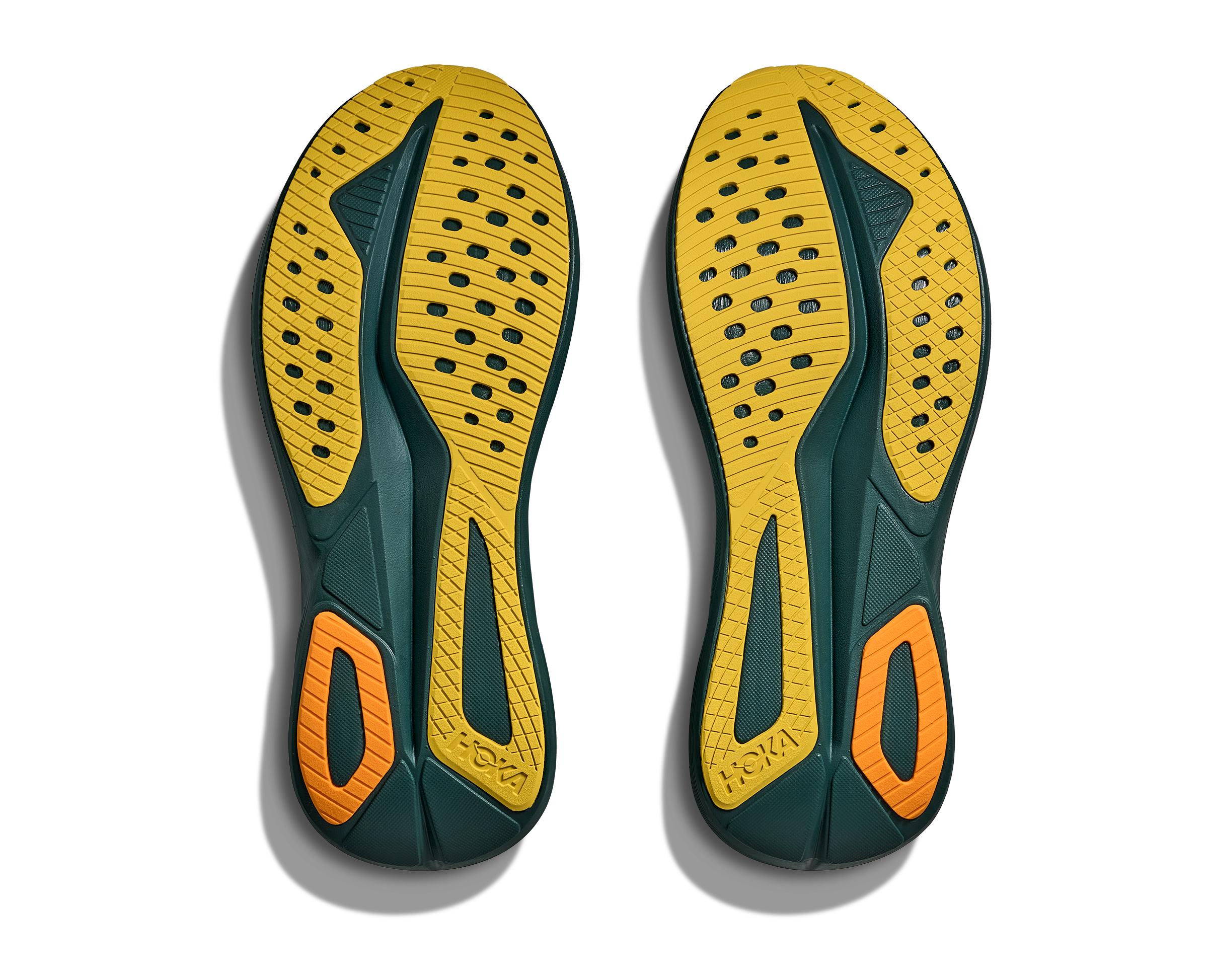 Yellow and green shoe insoles with orange accents on a white background
