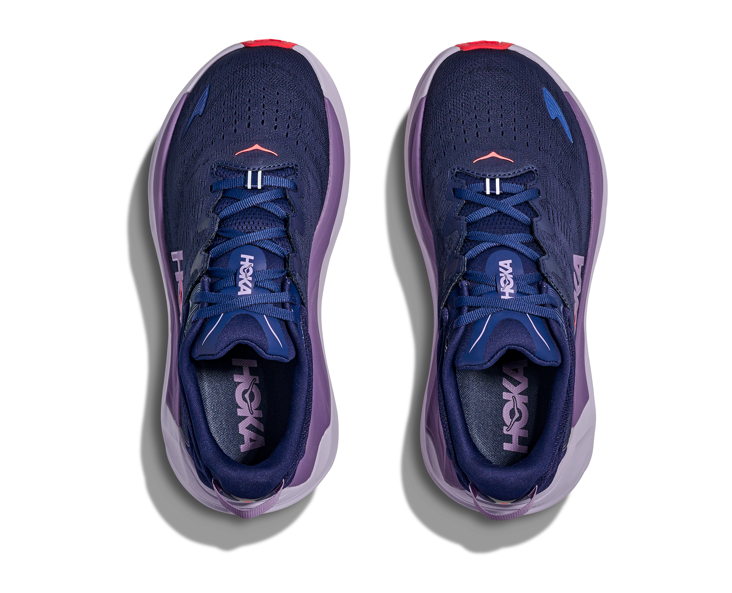 Purple running shoes with 'Hoka' branding on a white background
