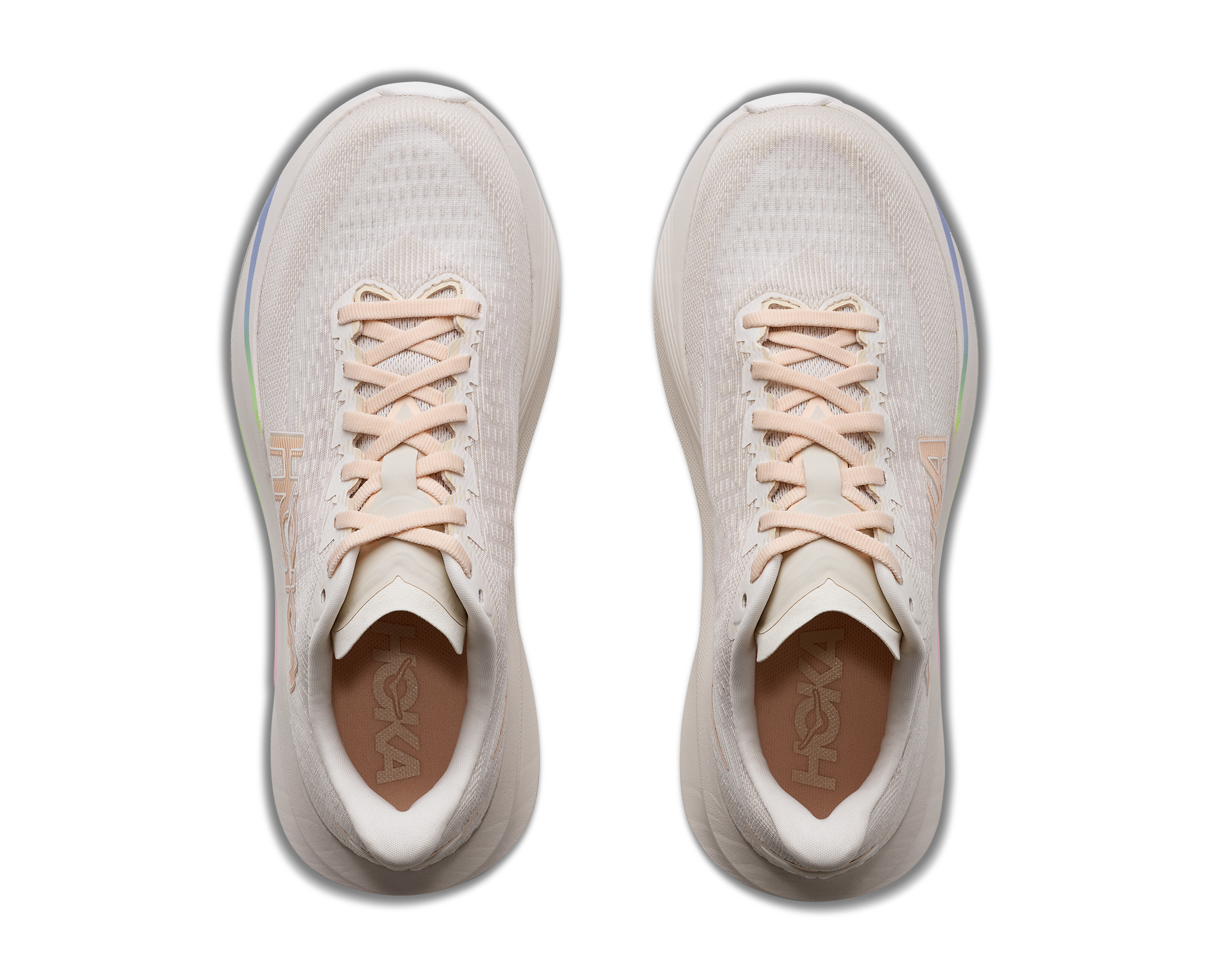 Pair of light gray sneakers with pink laces on a white background