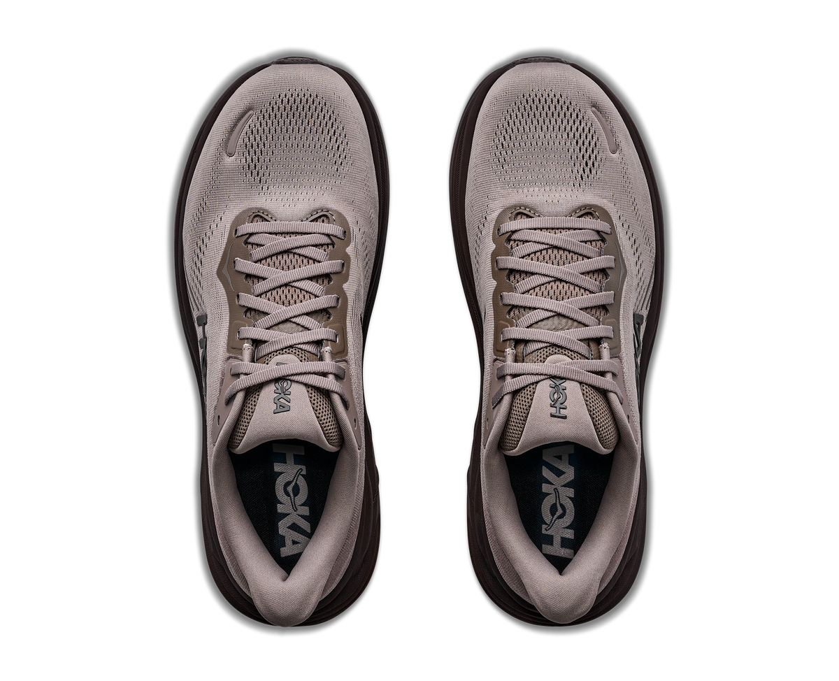Pair of gray athletic shoes with brand logo on a white background