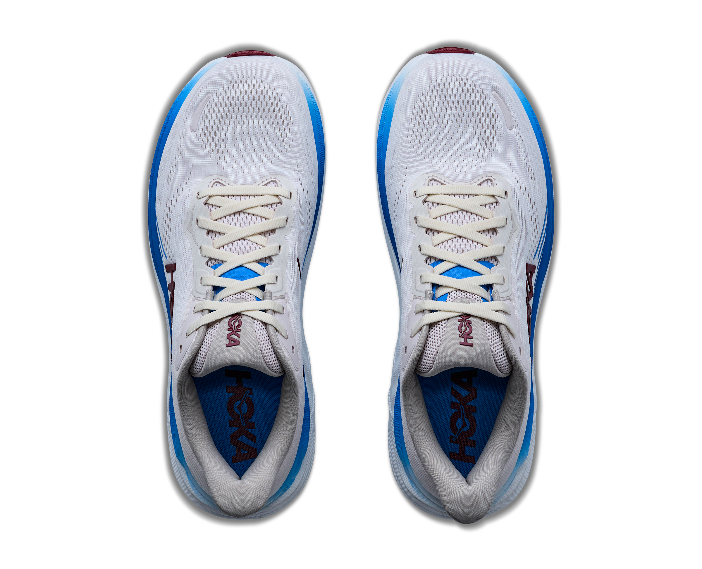 White running shoes with blue accents on a white background