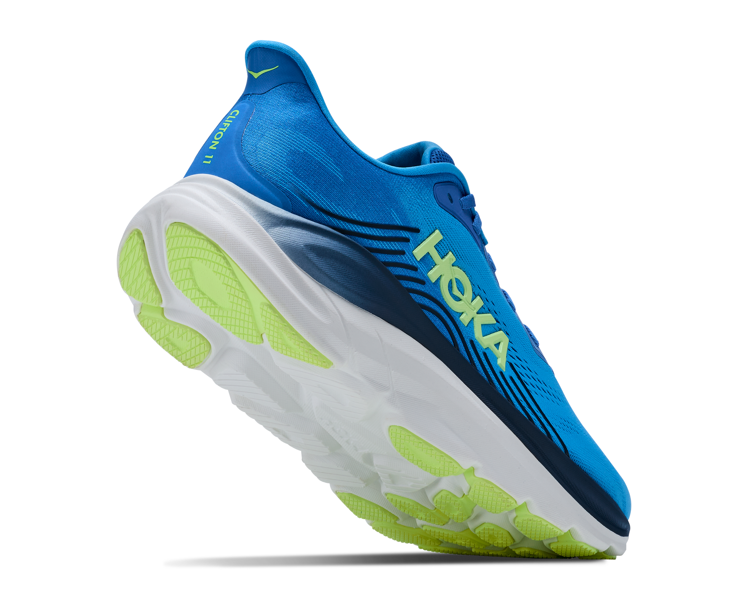 Blue running shoe with green sole on a white background