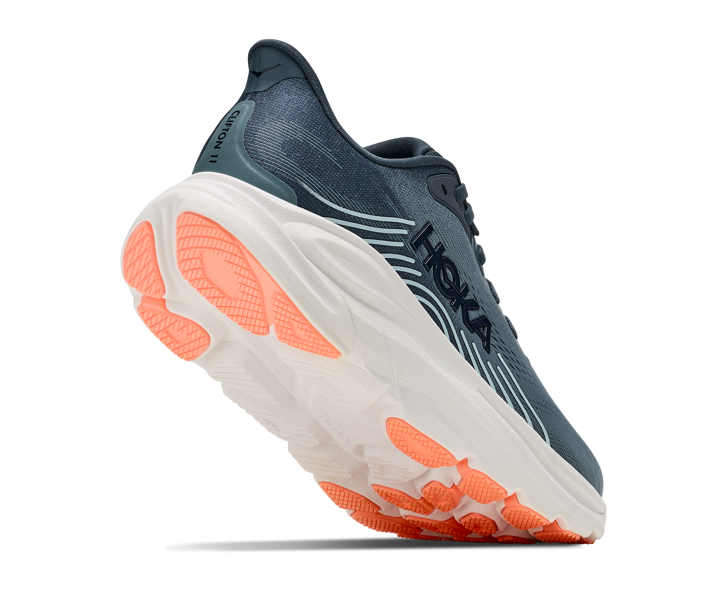 Blue running shoe with orange sole on a white background