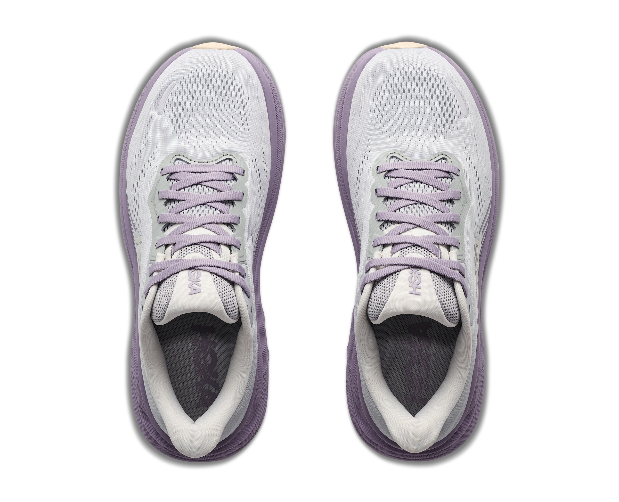 Pair of white and purple running shoes on a white background