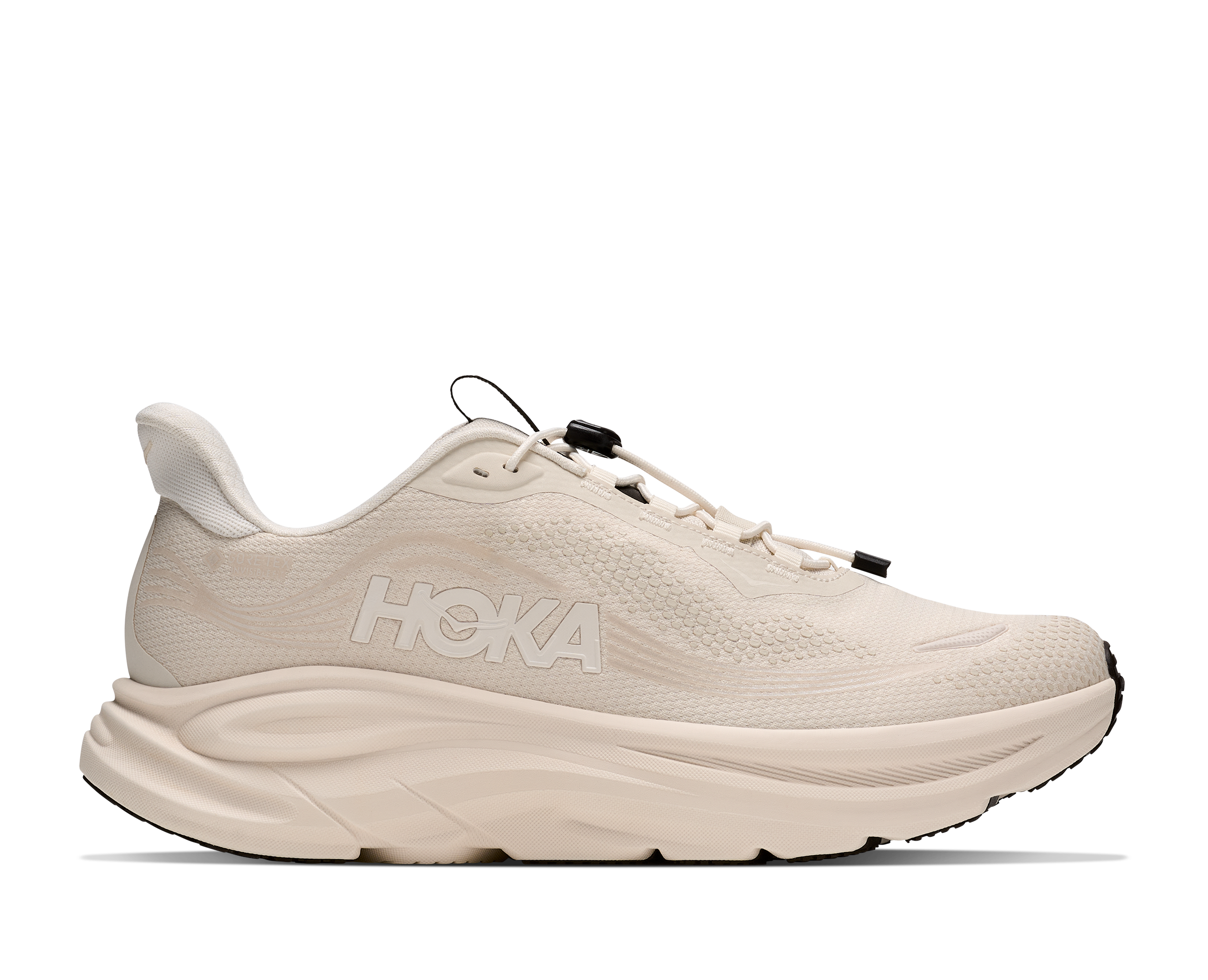 Beige running shoe with Hoka branding on a white background