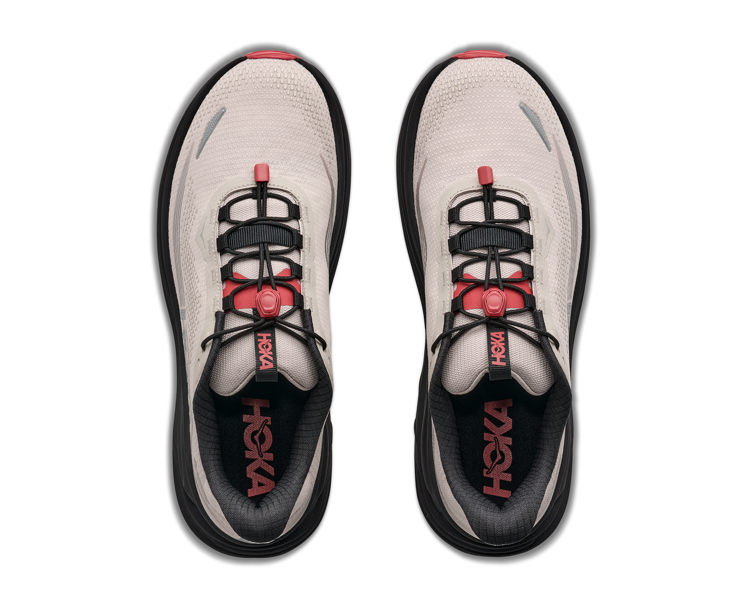 Pair of white and black running shoes with red accents on a white background