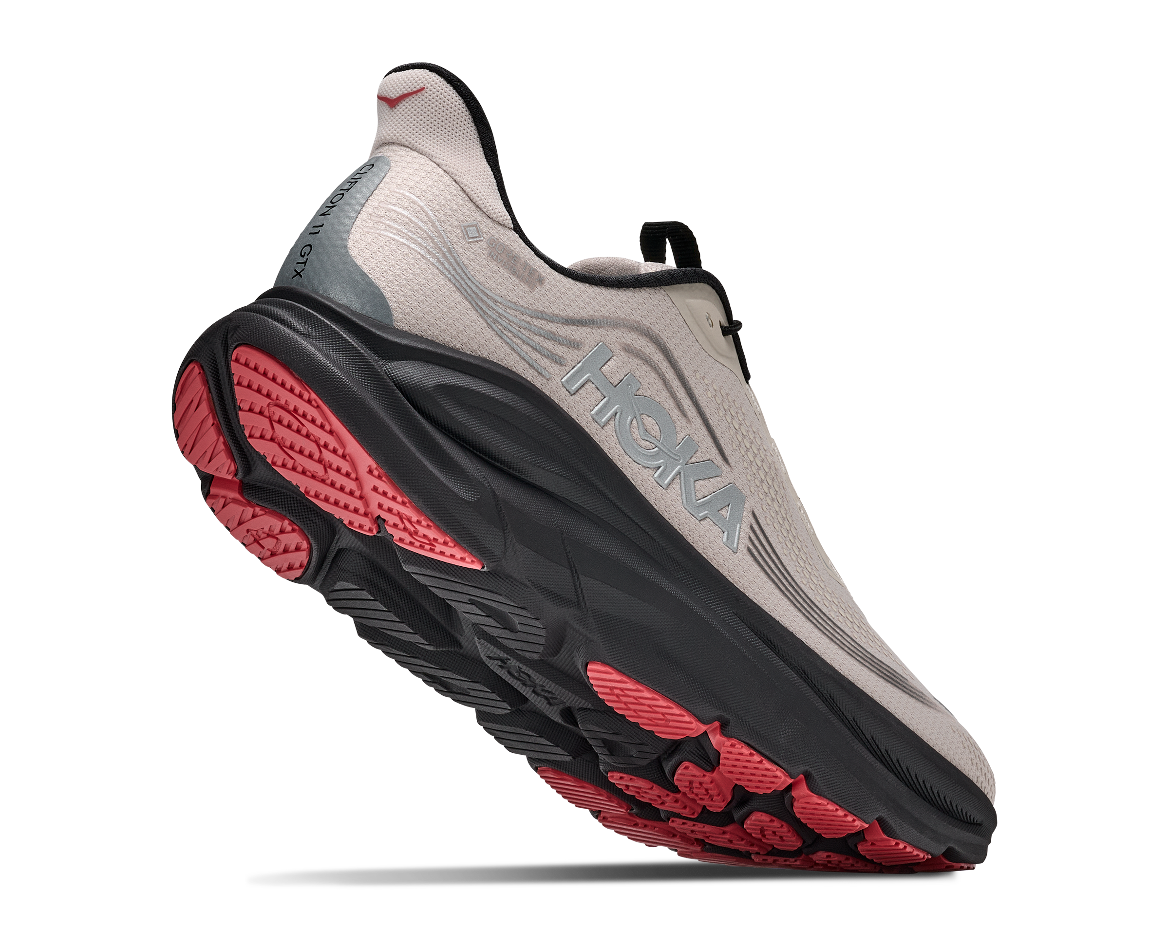 Hoka running shoe with red sole on a white background