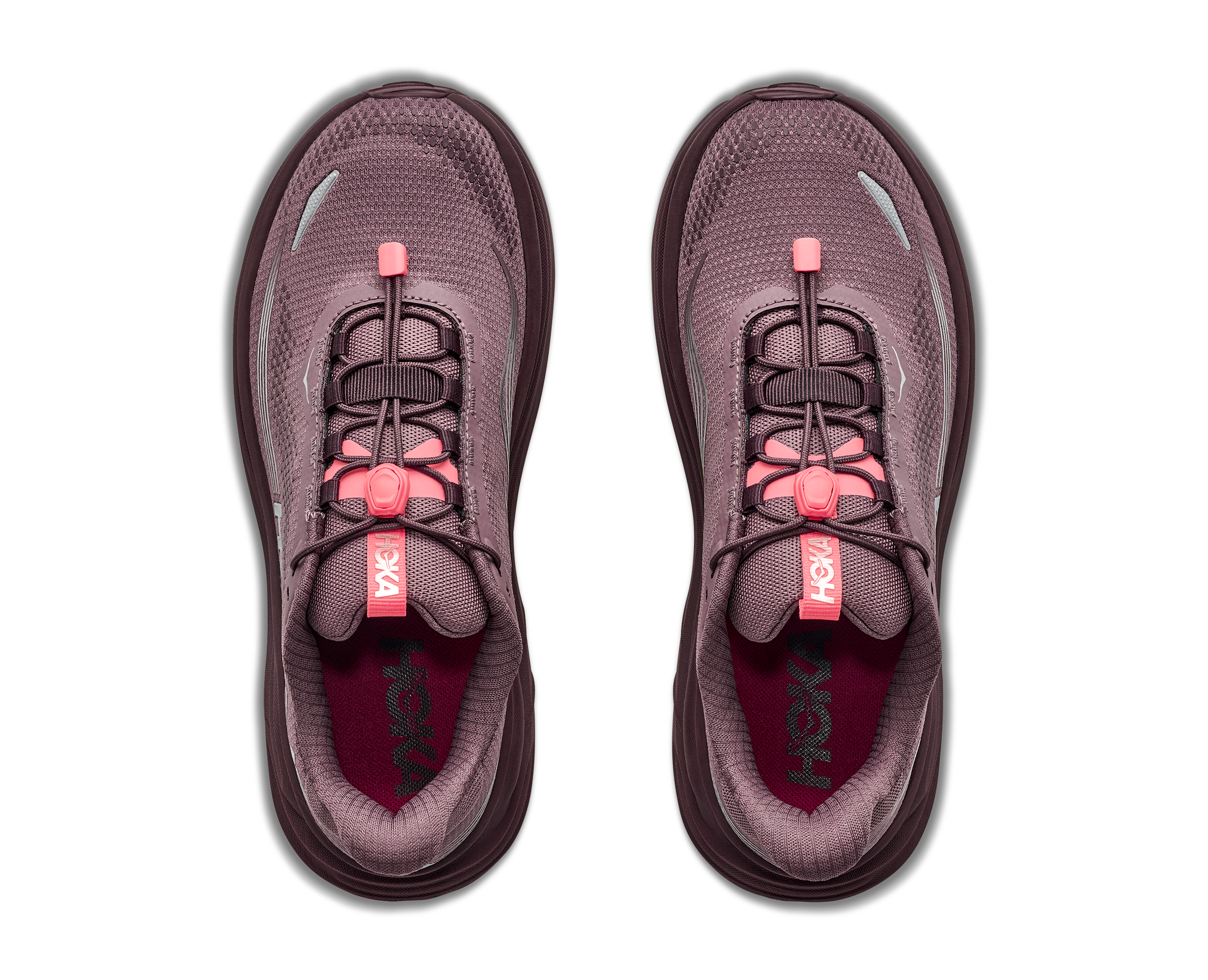 Pair of purple running shoes with pink accents on a white background
